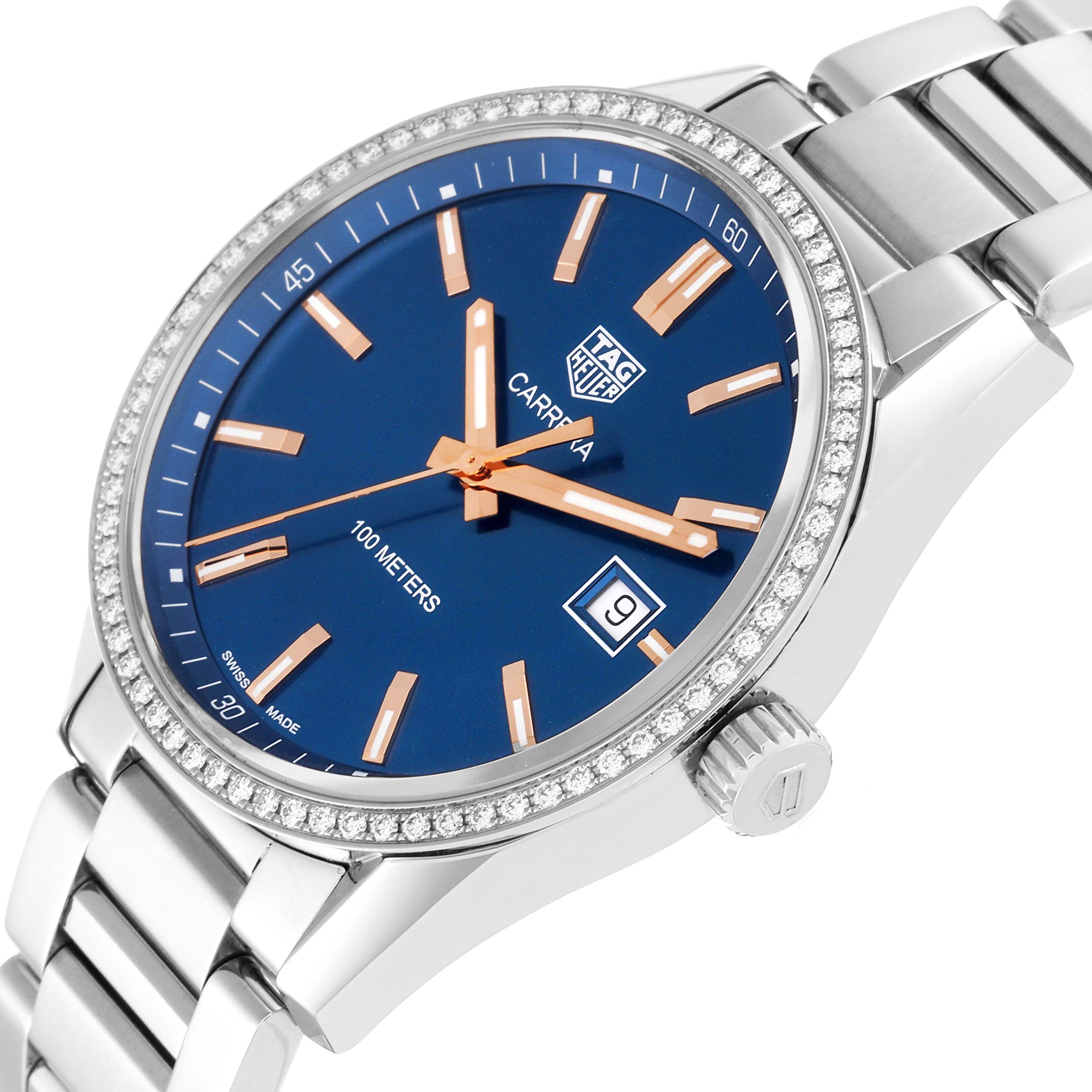 The image shows a close-up angle of the Tag Heuer Carrera WAR1114.BA0601 Men's Stainless Steel Blue Dial WAR1114.BA0601 Men's Stainless Steel Blue Dial watch, highlighting its blue dial, date display, and stainless steel bracelet.