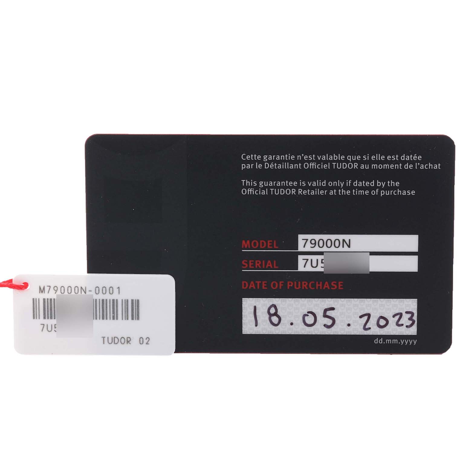 The image shows a warranty card for the Tudor Heritage Black Bay M79000N-0001 Men's Stainless Steel Black Dial M79000N-0001 Men's Stainless Steel Black Dial watch, including model, serial number, and purchase date.