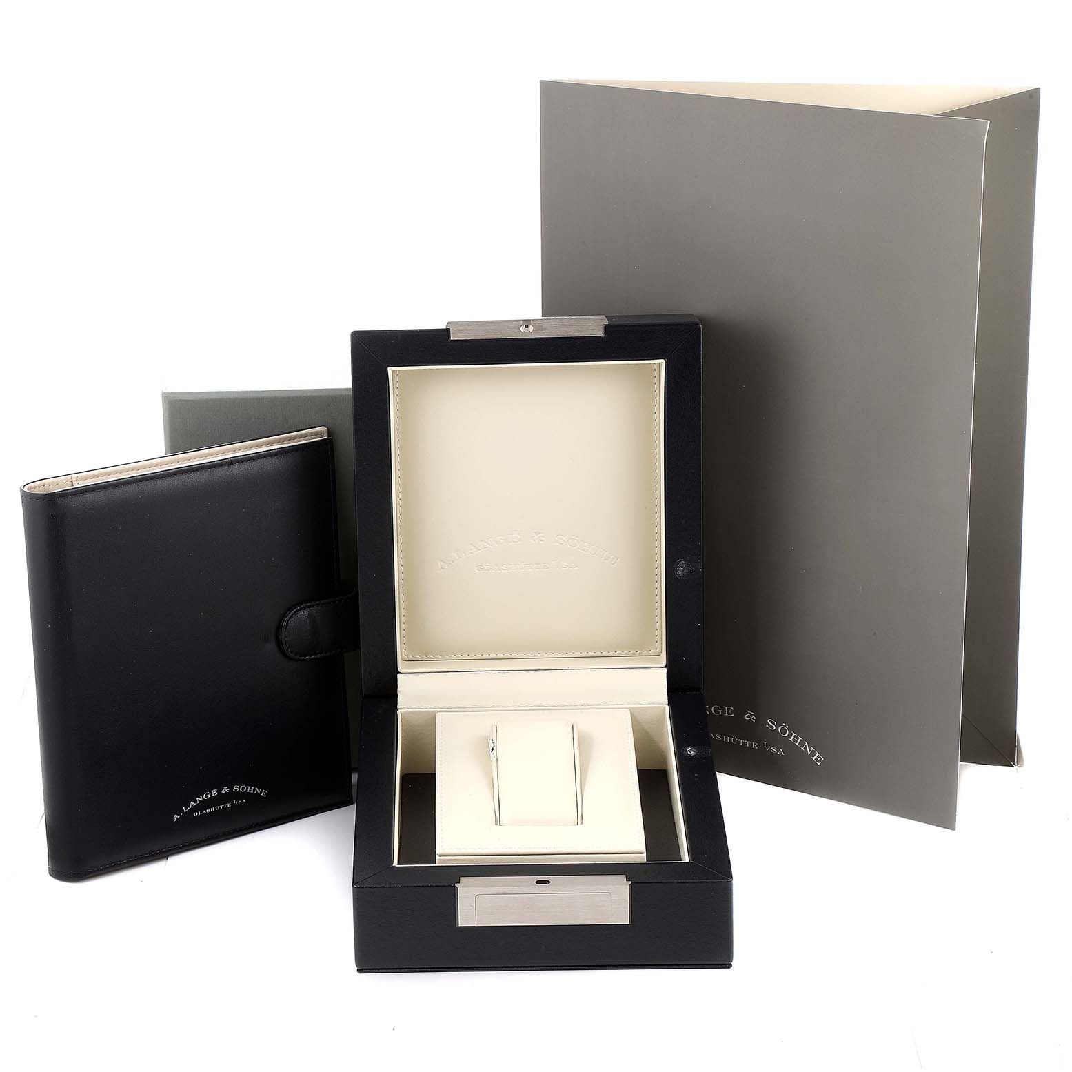 The image shows the packaging of an A. Lange & Sohne Lange 1 109.025 Men's Platinum Silver Dial model watch, including a display box, booklet, and outer cardboard.