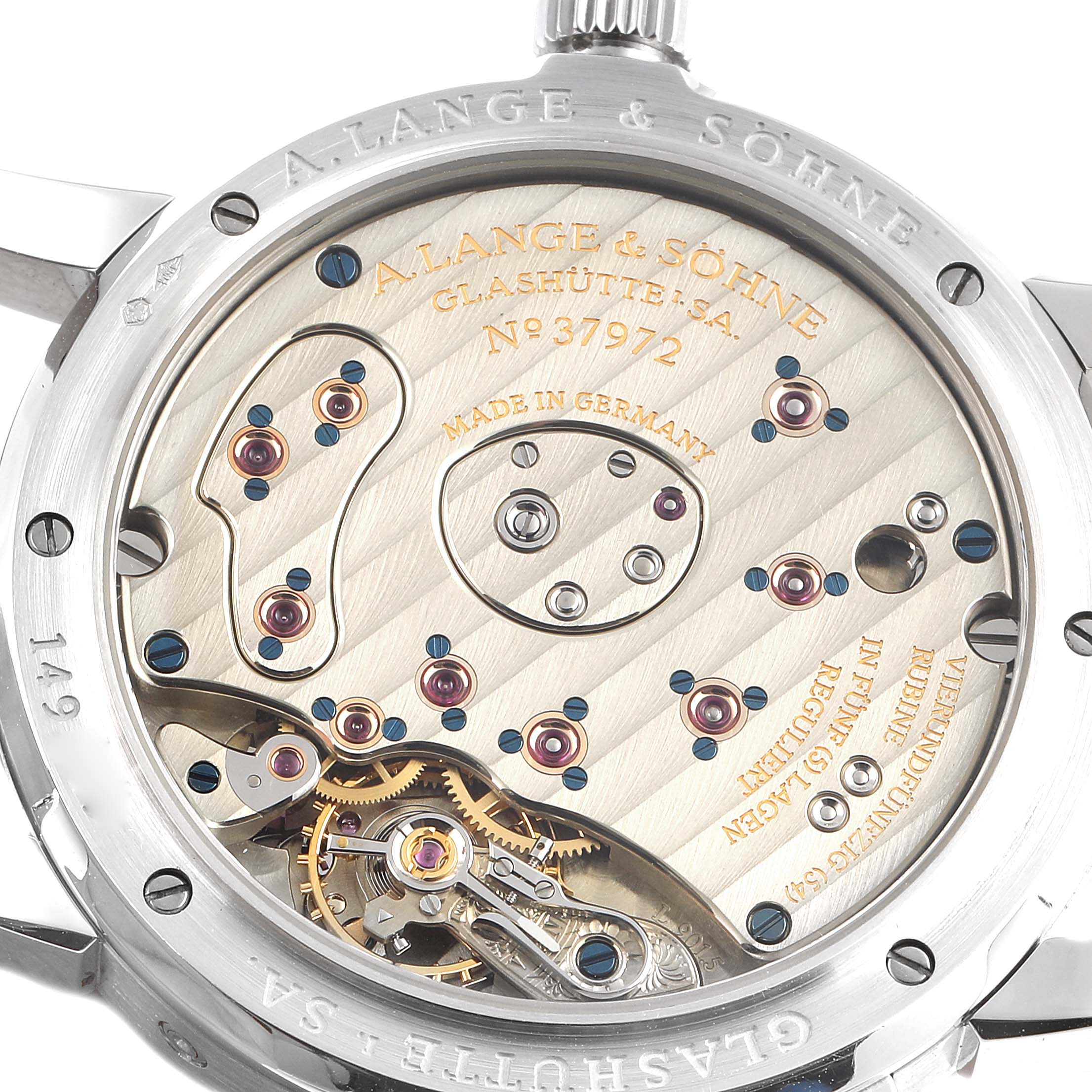 The image shows the back view of the A. Lange & Sohne Lange 1 109.025 Men's Platinum Silver Dial watch, showcasing its intricate mechanical movement.