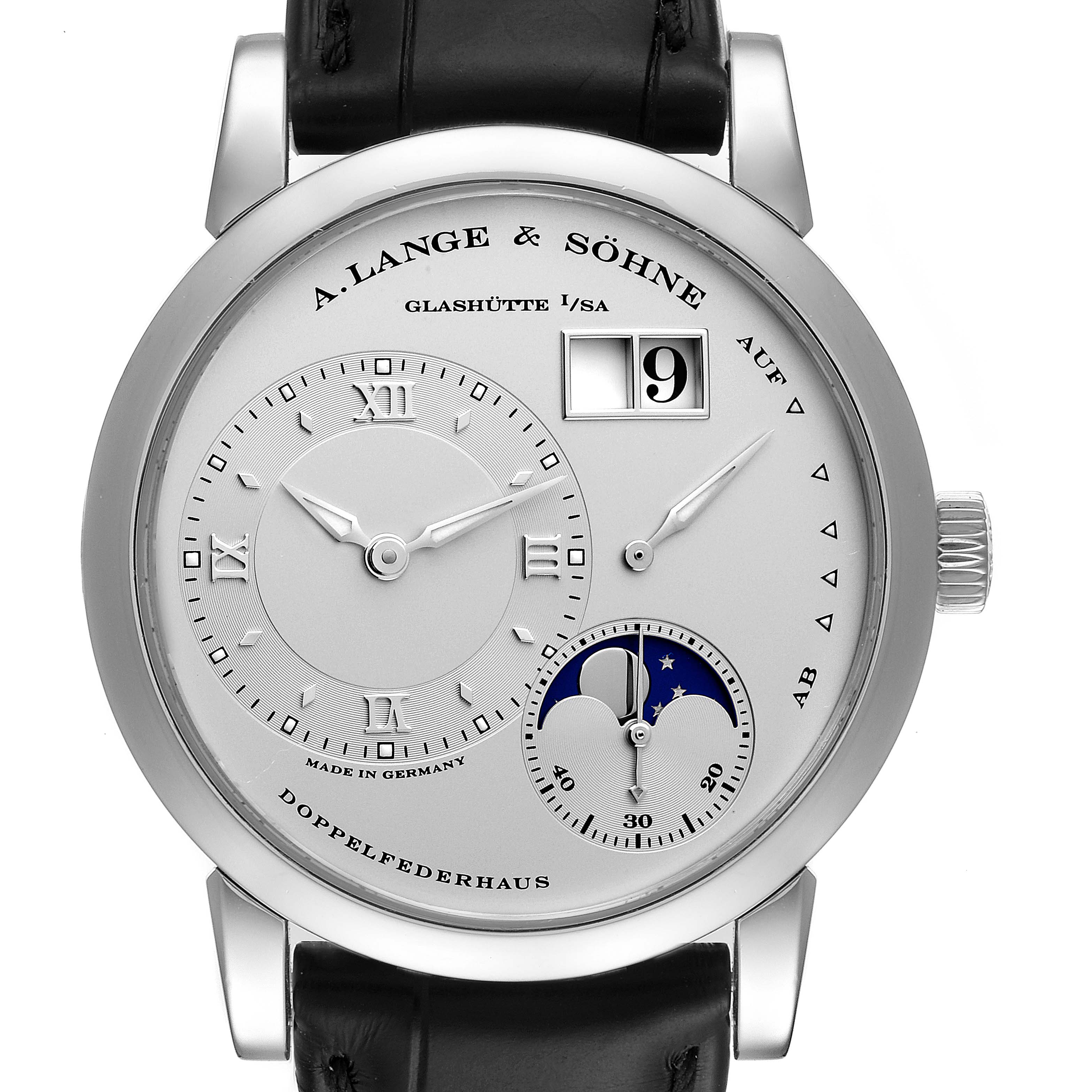 The image shows a front view of an A. Lange & Sohne Lange 1 109.025 Men's Platinum Silver Dial watch, displaying its dial, subdials, and moon phase indicator.