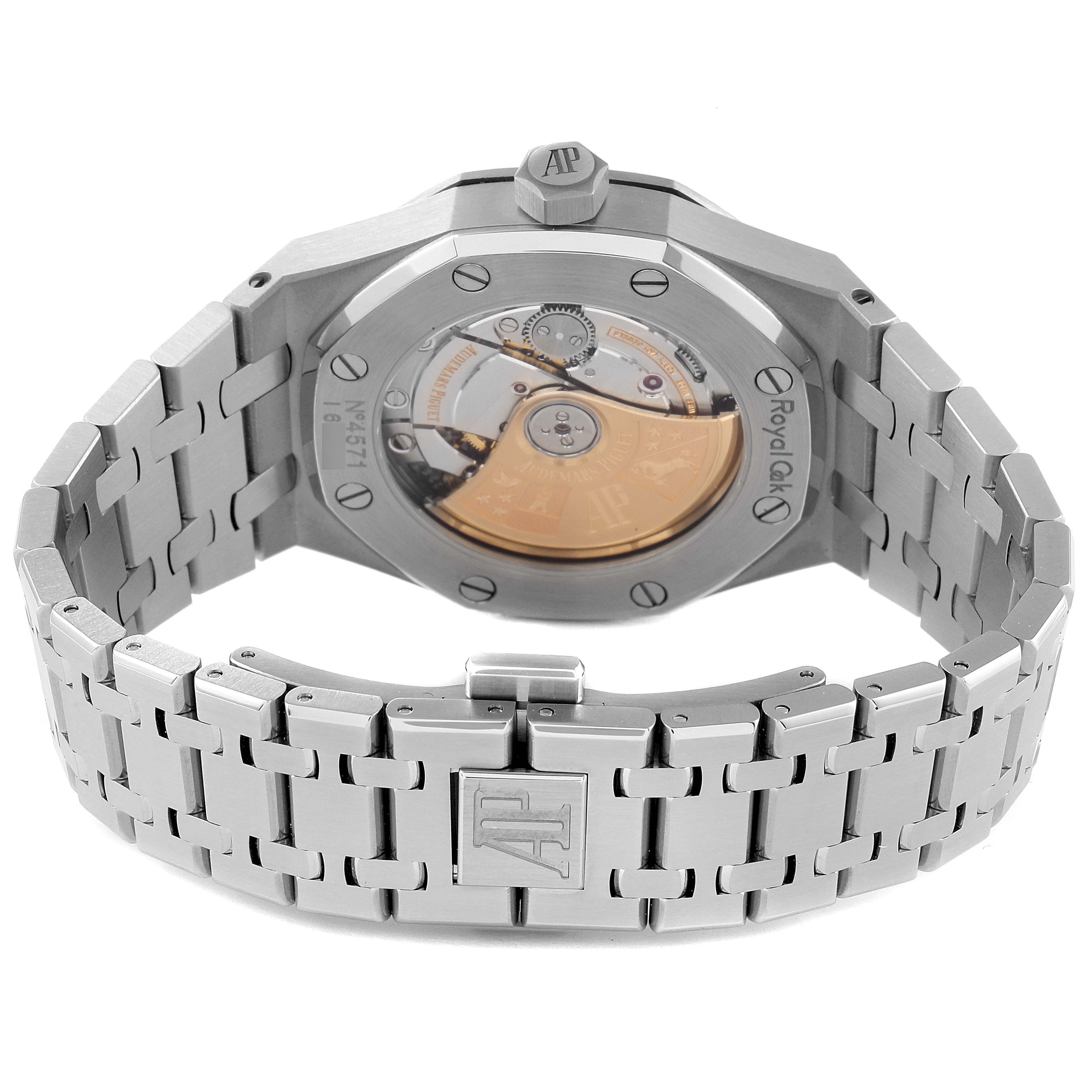 The image shows the back view of an Audemars Piguet Royal Oak 15450ST.OO.1256ST.01 Men's Stainless Steel Silver Dial 15450ST.OO.1256ST.01 Men's Stainless Steel Silver Dial watch, highlighting its movement and metal bracelet.
