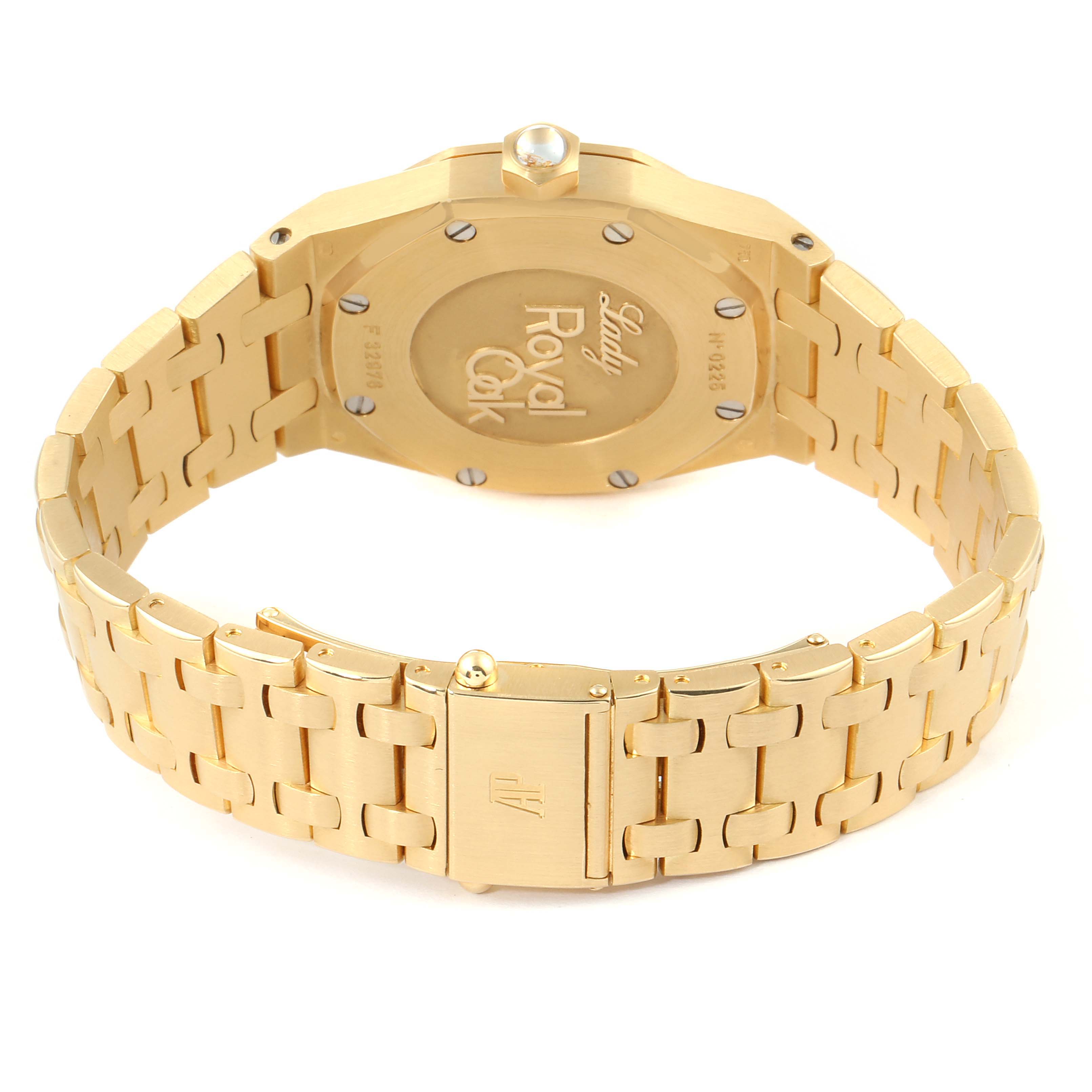 This image shows the back case and clasp of an Audemars Piguet Royal Oak 67601BA.ZZ.1210BA.02 Men's Yellow Gold Mother of Pearl Dial 67601BA.ZZ.1210BA.02 Men's Yellow Gold Mother of Pearl Dial watch in gold.