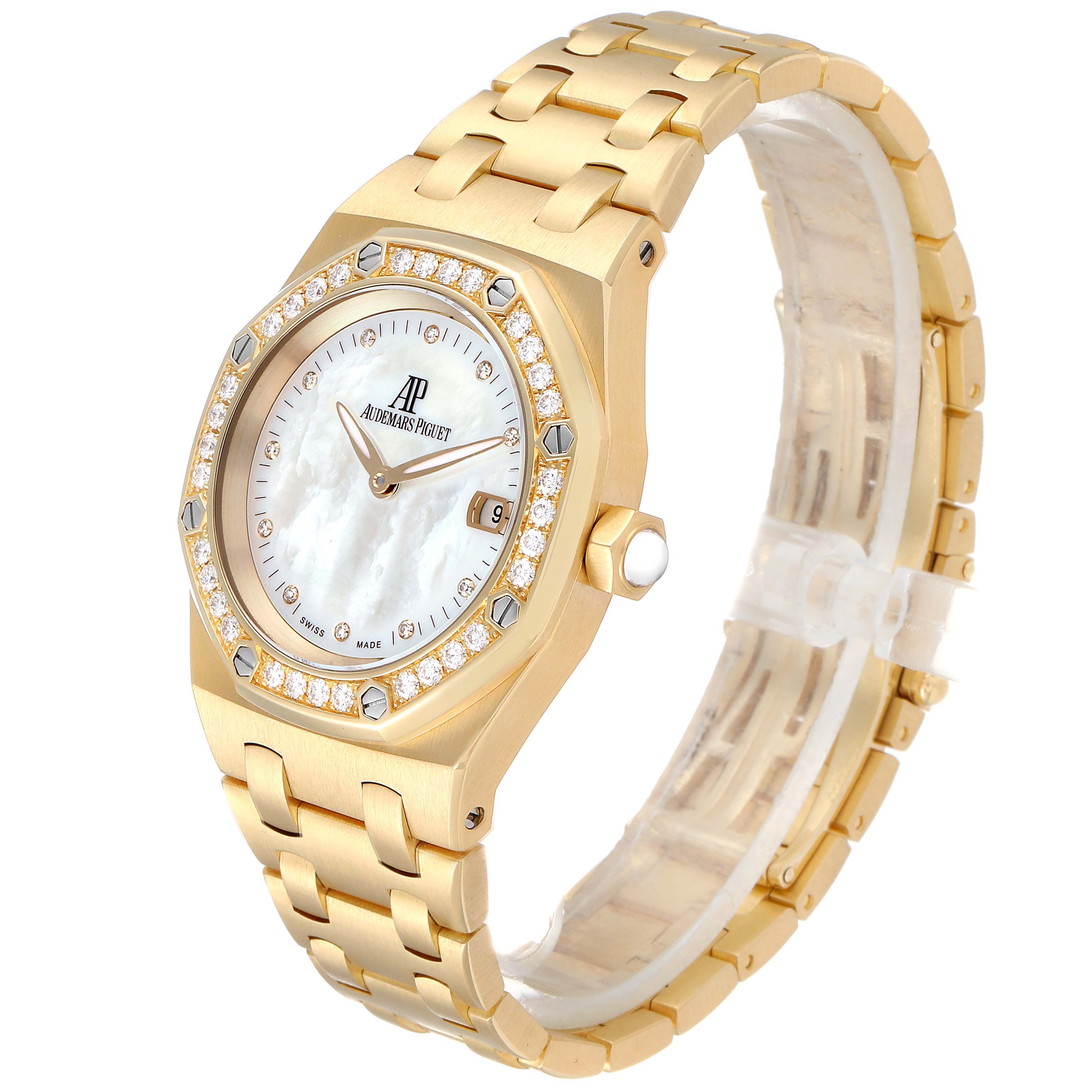 The image shows a side angle of the Audemars Piguet Royal Oak 67601BA.ZZ.1210BA.02 Men's Yellow Gold Mother of Pearl Dial 67601BA.ZZ.1210BA.02 Men's Yellow Gold Mother of Pearl Dial, highlighting the bracelet, dial, bezel, and crown.