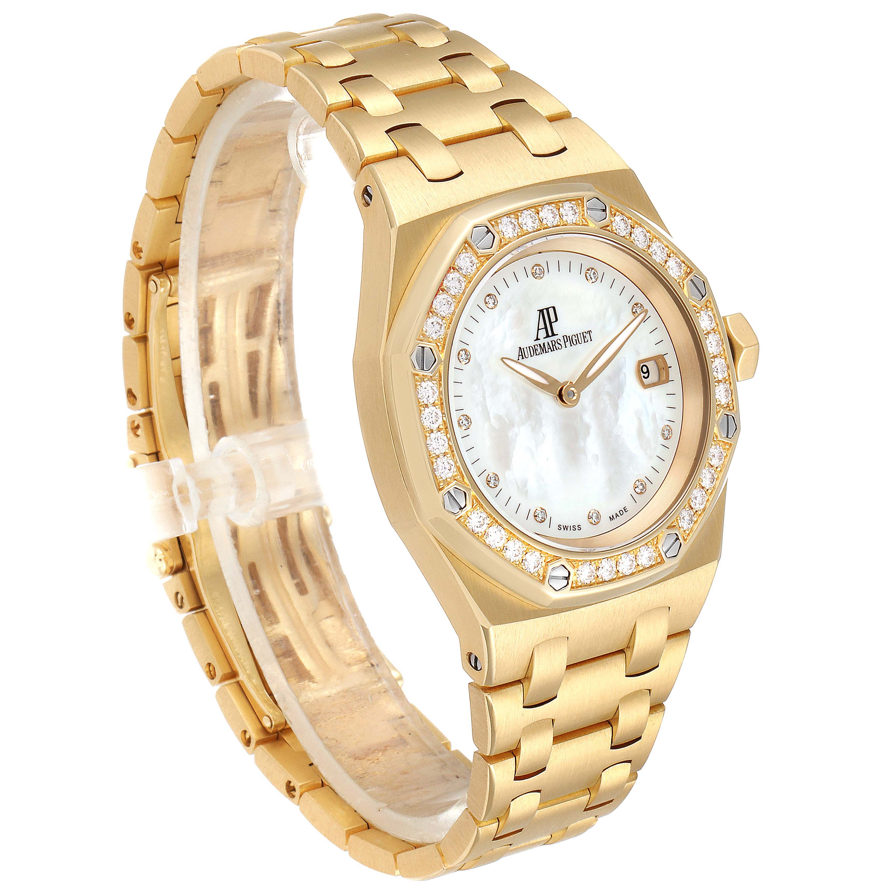 This image shows a gold Audemars Piguet Royal Oak 67601BA.ZZ.1210BA.02 Men's Yellow Gold Mother of Pearl Dial 67601BA.ZZ.1210BA.02 Men's Yellow Gold Mother of Pearl Dial watch, highlighting its face, bezel, and bracelet at a slight angle.