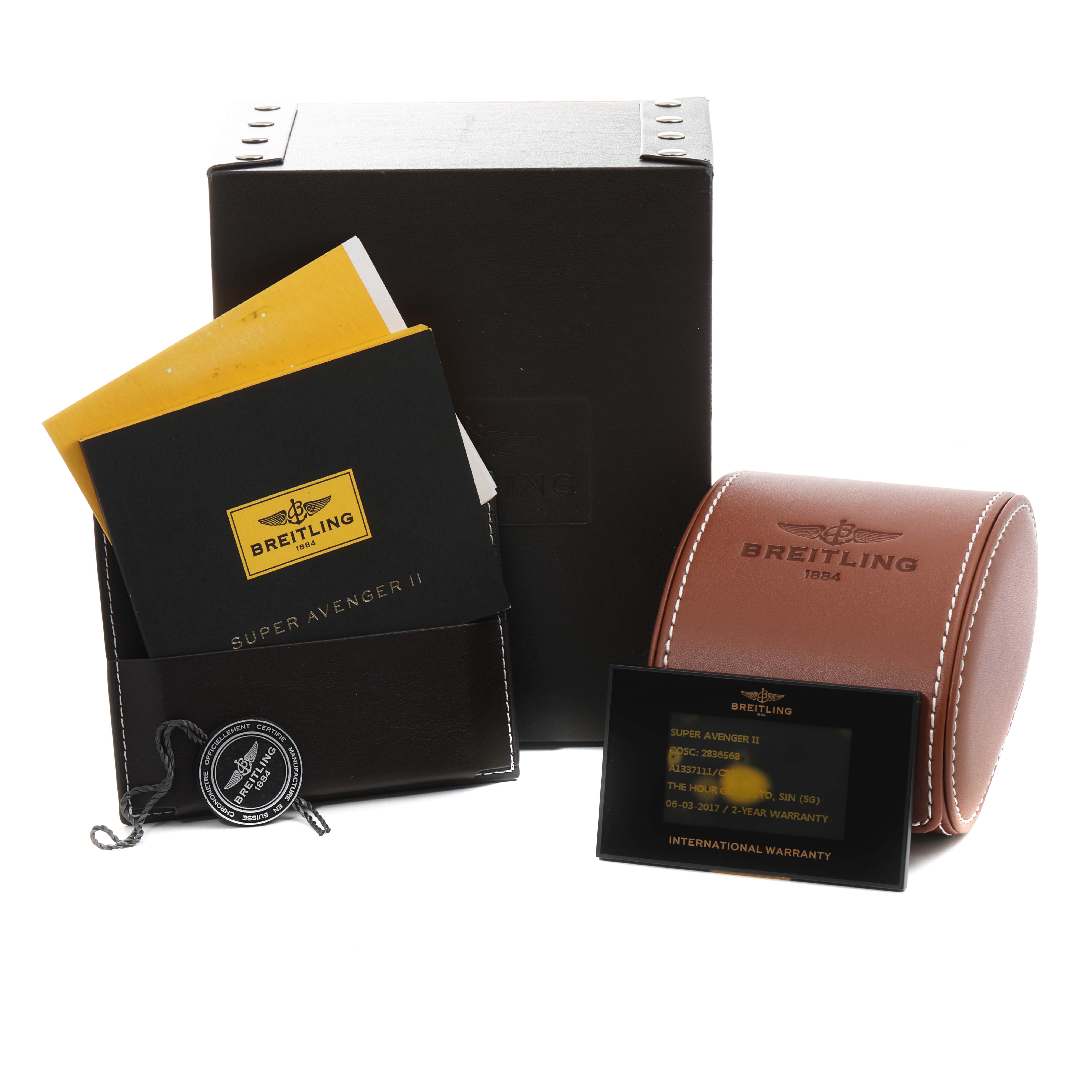 The image shows the packaging, manuals, warranty card, and leather case for a Breitling Avenger A13371 Men
s Stainless Steel Blue Dial A13371 Men
s Stainless Steel Blue Dial watch.