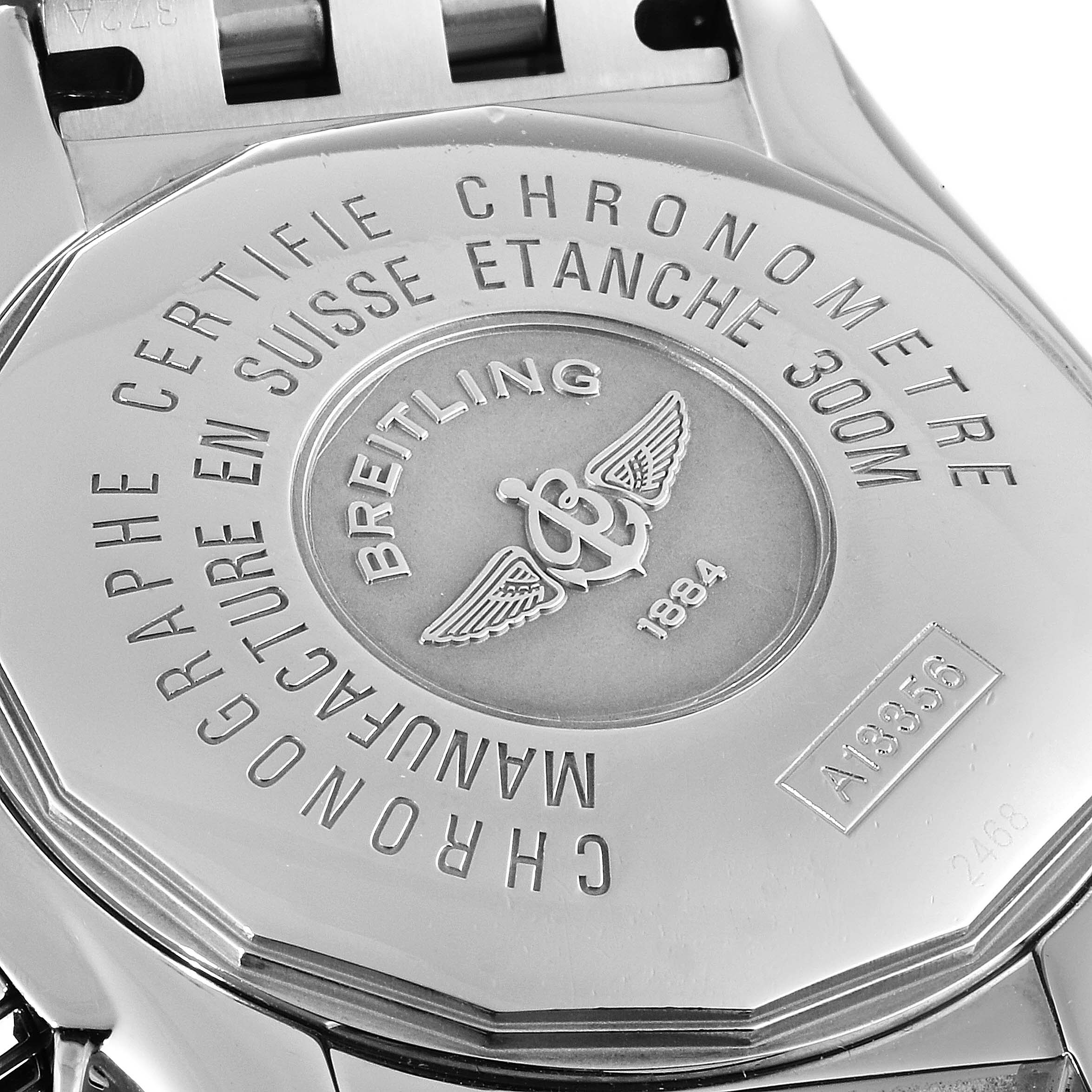 The image shows the case back of a Breitling Chronomat A13356 Men
s Stainless Steel Black Dial A13356 Men
s Stainless Steel Black Dial watch, detailing its certifications and water resistance.