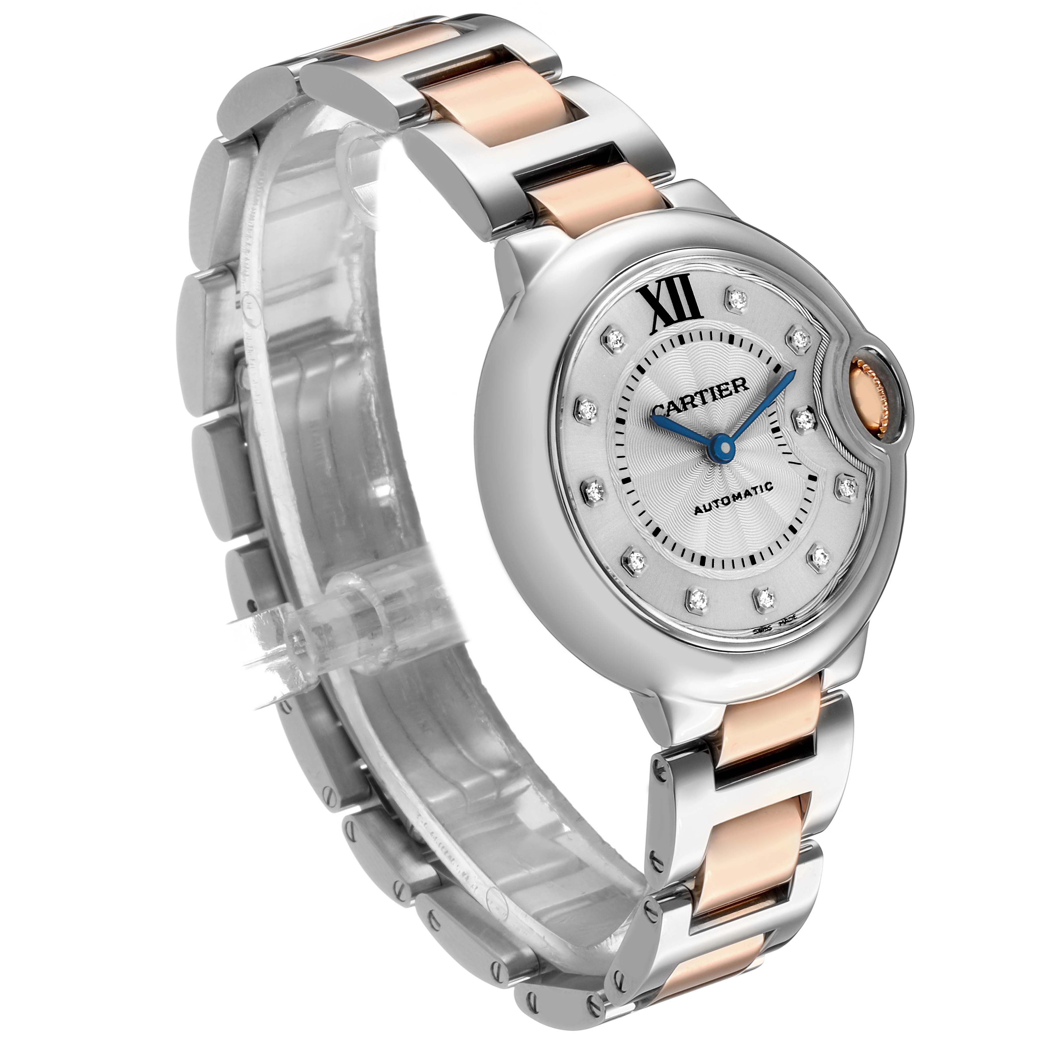 The Cartier Ballon Bleu WE902044 Women's Steel and Gold (two tone) Silver Dial watch is shown at a three-quarter angle, highlighting its round case, crown, and dual-tone bracelet.