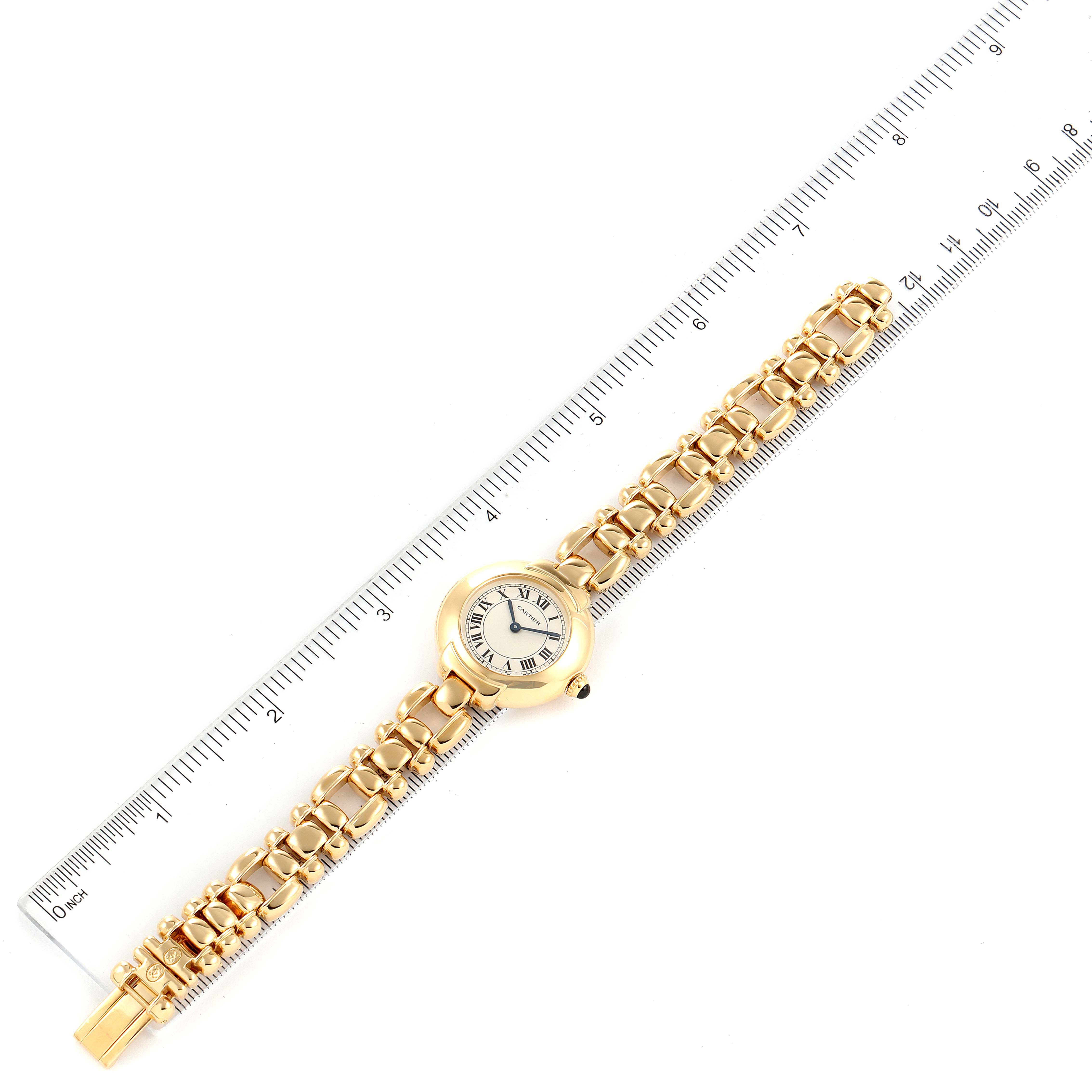 The image shows a top-down view of the Cartier Colisee Women's Yellow Gold Silver Dial Women's Yellow Gold Silver Dial watch, highlighting the face, band, and clasp alongside a ruler for size reference.