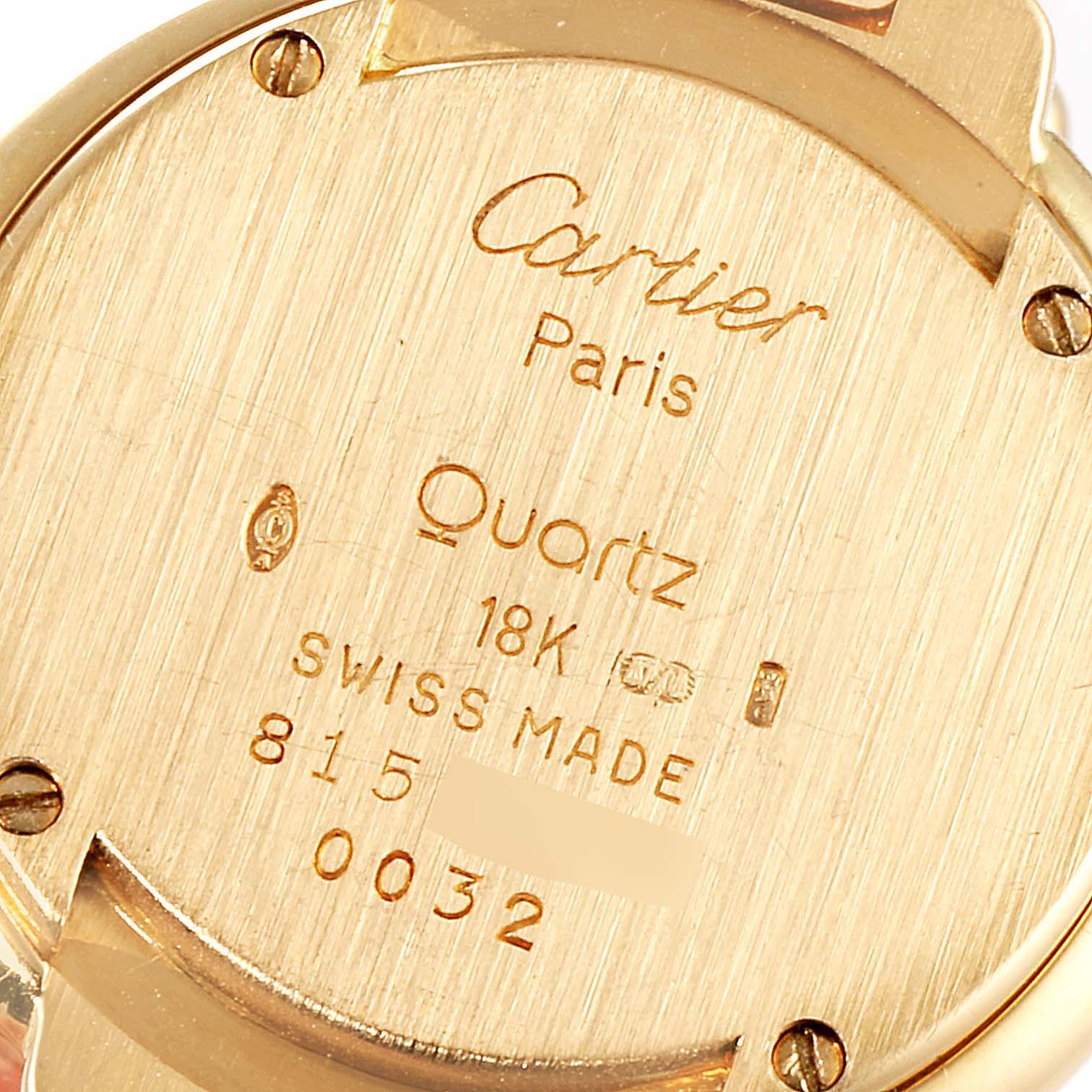 This image shows the back case of a Cartier Colisee Women's Yellow Gold Silver Dial Women's Yellow Gold Silver Dial Quartz watch, highlighting its detailing and inscriptions.