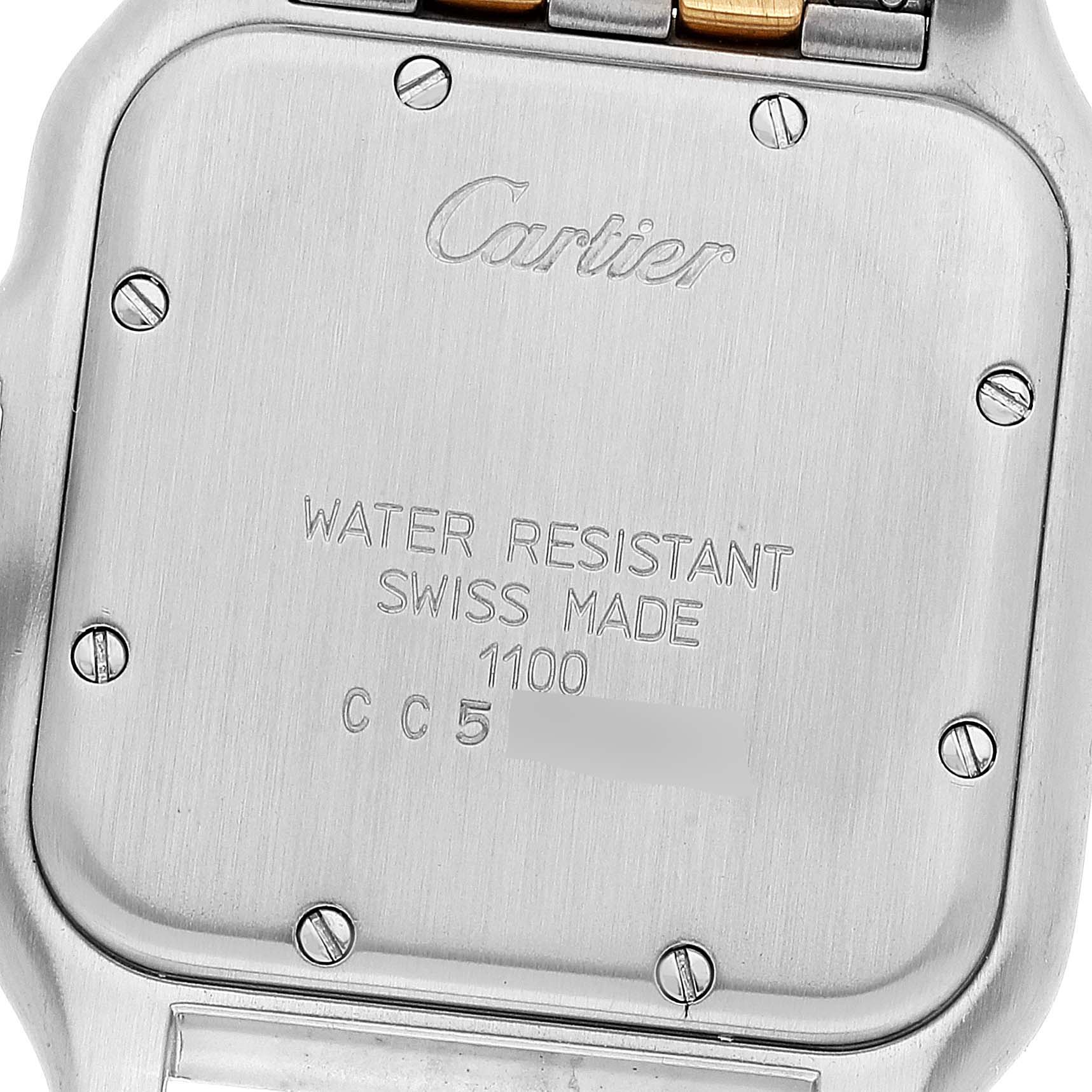 This image shows the back case of the Cartier Panthere W25028B8 Women's Steel and Gold (two tone) Silver Dial W25028B8 Women's Steel and Gold (two tone) Silver Dial watch, displaying its engravings and screws.