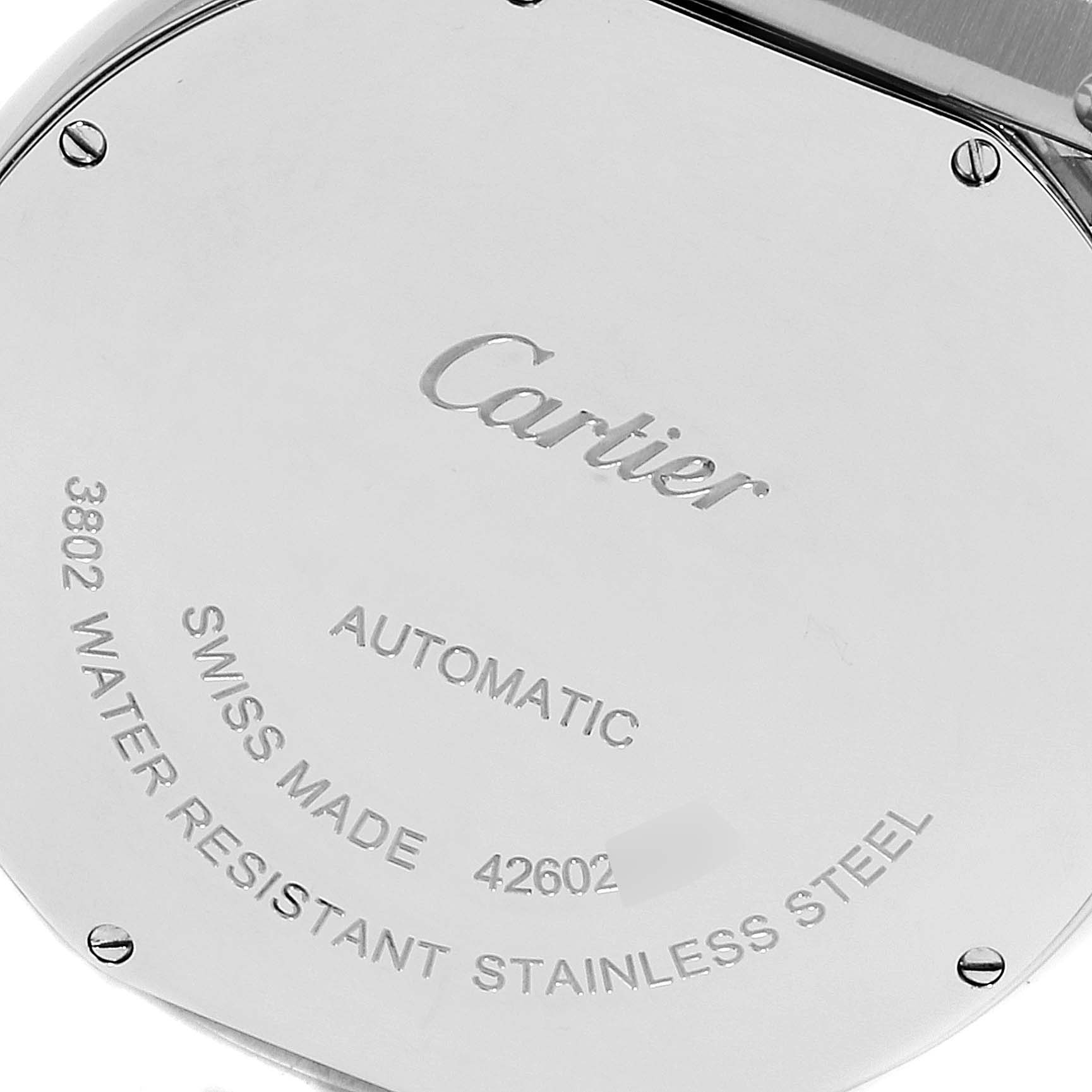 This image shows the back case of a Cartier Ronde WSRN0023 Men's Stainless Steel Blue Dial WSRN0023 Men's Stainless Steel Blue Dial model watch, displaying its inscriptions and screws.