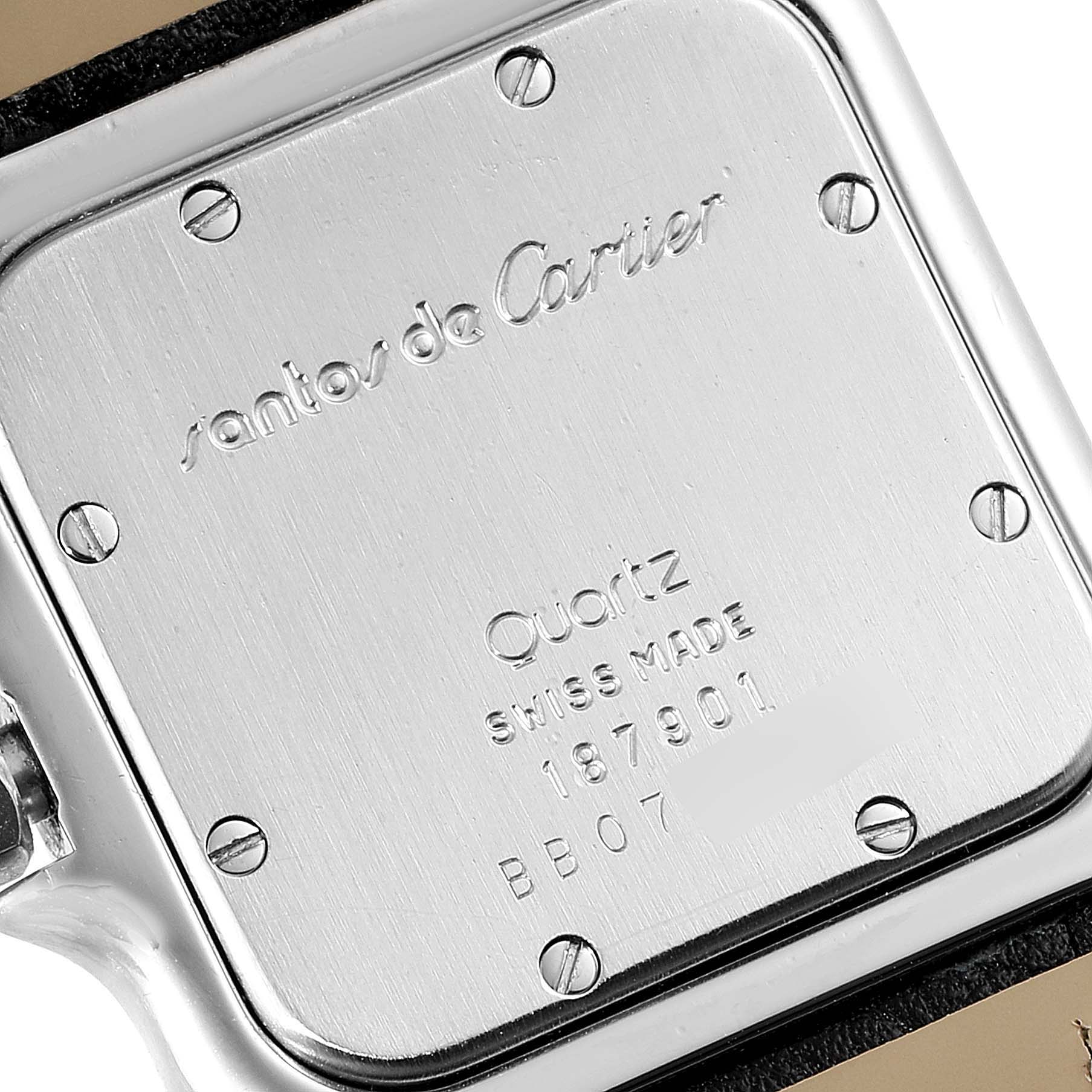 This image shows the back case of a Santos model Cartier watch, highlighting engravings and screws.