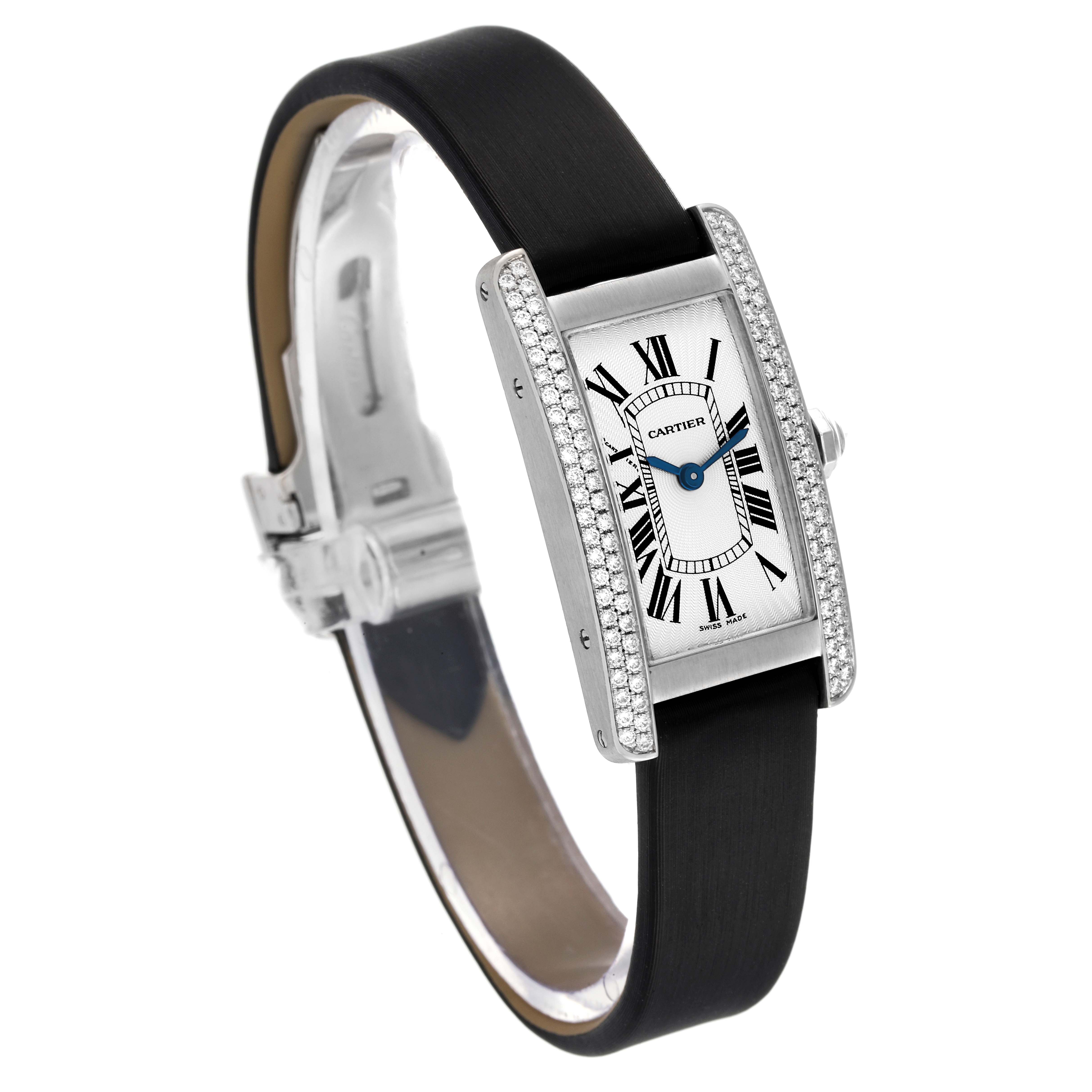 The Tank Americaine by Cartier is shown from a three-quarter angle, displaying the face, diamond bezel, strap, and clasp.