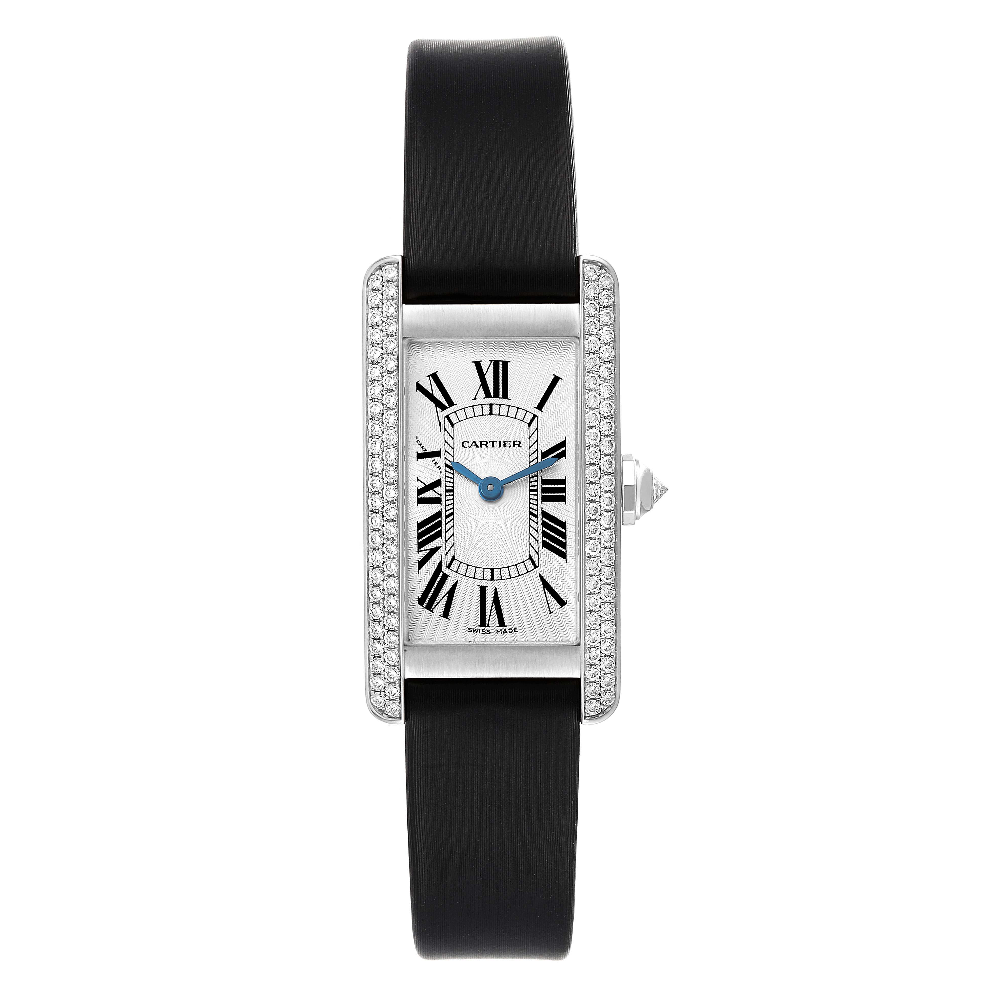 The image shows a Cartier Tank Americaine WB701851 Women's White Gold Silver Dial WB701851 Women's White Gold Silver Dial watch from a front view, displaying the face, Roman numerals, and black strap.