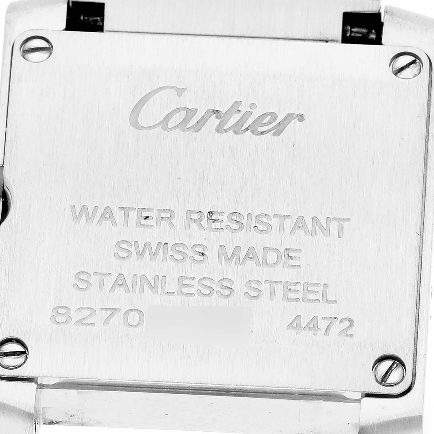 The image shows the back of a Cartier Tank Française watch, highlighting the engraved details and screws.