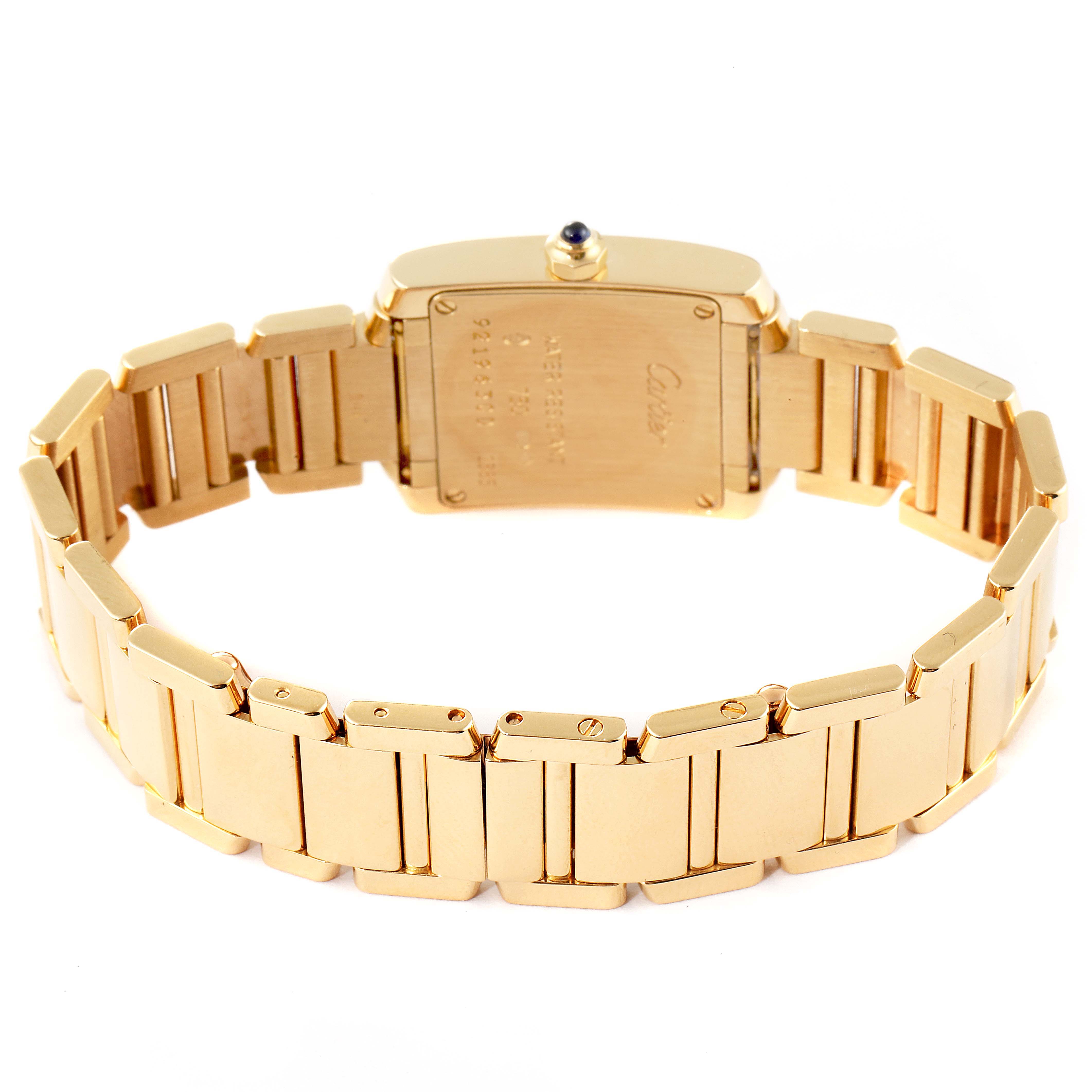 The image shows the back view of the Tank Francaise model by Cartier, highlighting the gold bracelet and case back.