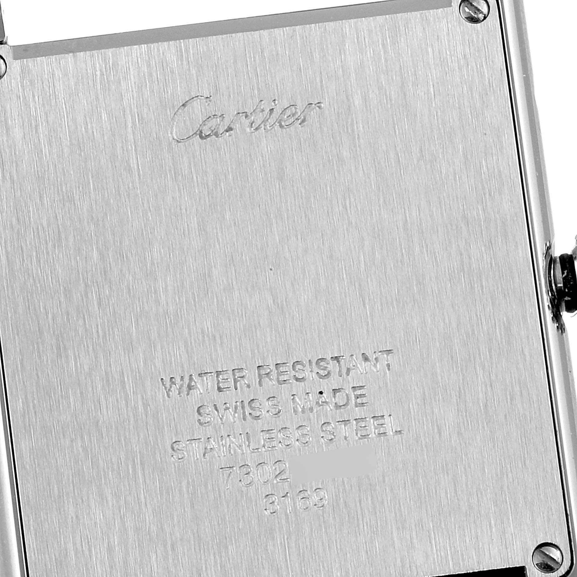 This image shows the back case of a Cartier Tank Solo W1018355 Men's Stainless Steel Silver Dial W1018355 Men's Stainless Steel Silver Dial watch, highlighting the engraved branding and specifications.