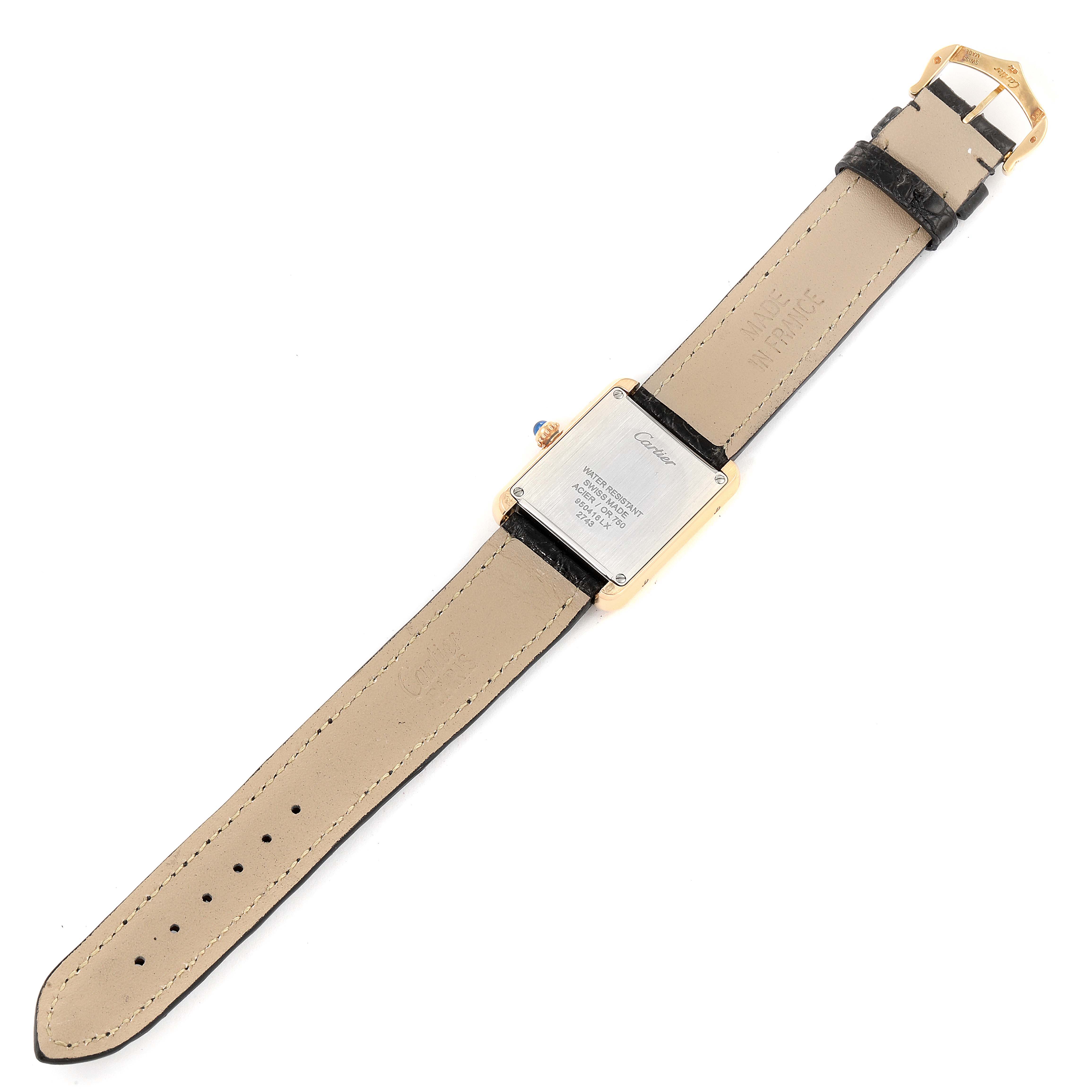 The image shows the back of the Cartier Tank Solo W1018755 Women
s Steel and Gold (two tone) Silver Dial W1018755 Women
s Steel and Gold (two tone) Silver Dial watch, with a focus on the case, leather band, and buckle.