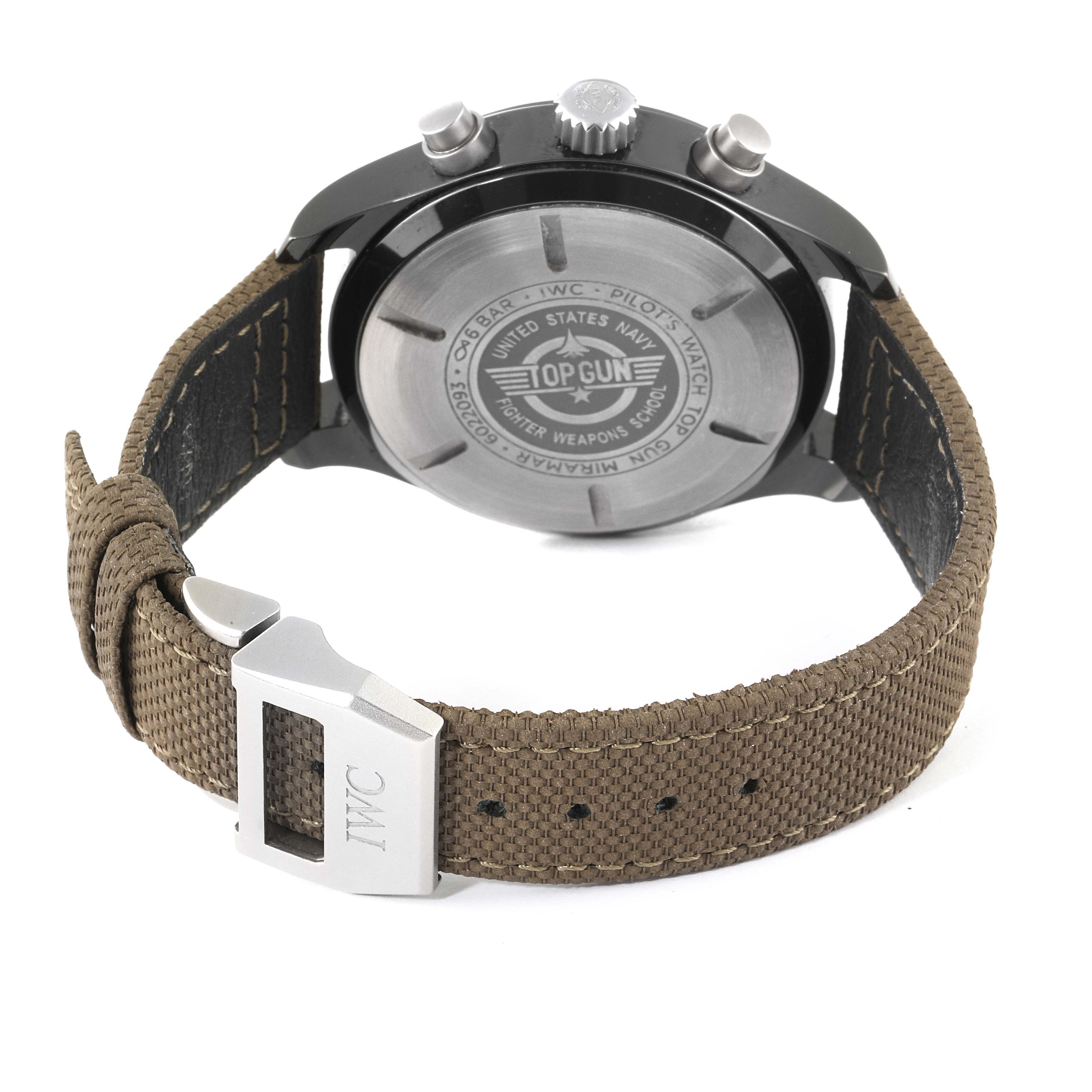 The image shows the back view of an IWC Pilot IW389002 Men's Ceramic Black Dial IW389002 Men's Ceramic Black Dial's Watch Top Gun model, highlighting the case back and fabric strap with its clasp.