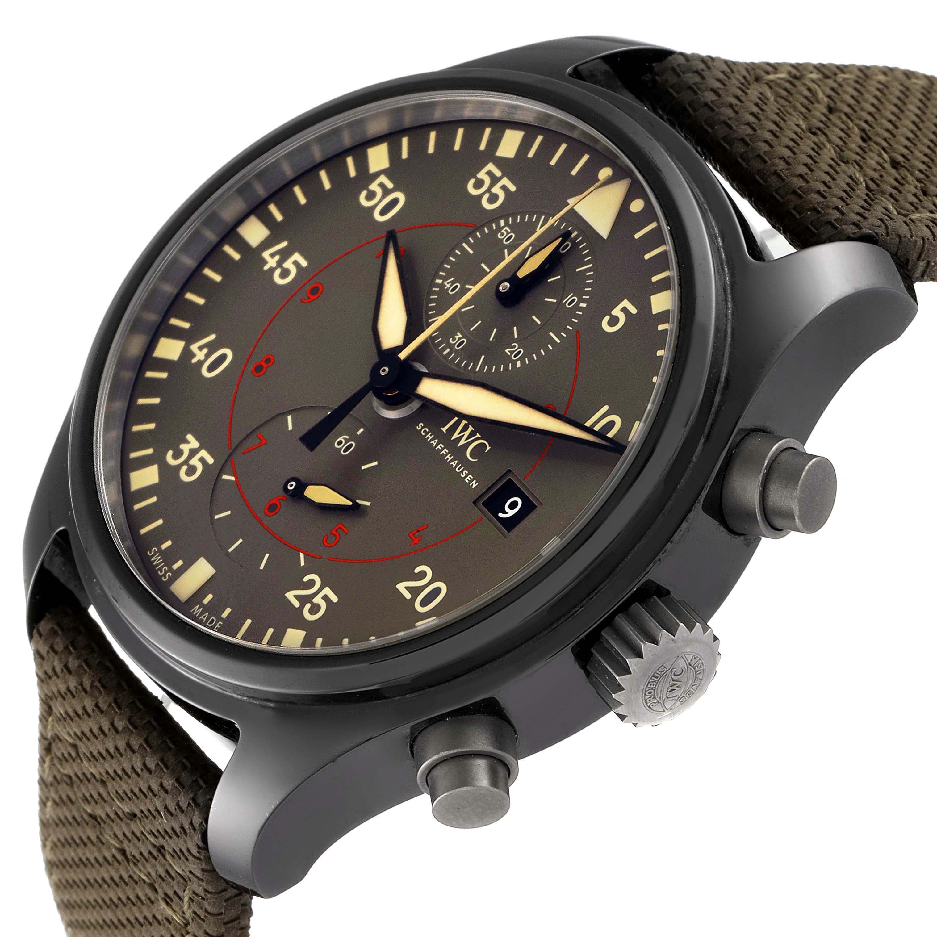 The image shows an angled close-up of the dial, crown, and pushers of an IWC Pilot IW389002 Men's Ceramic Black Dial IW389002 Men's Ceramic Black Dial watch model.