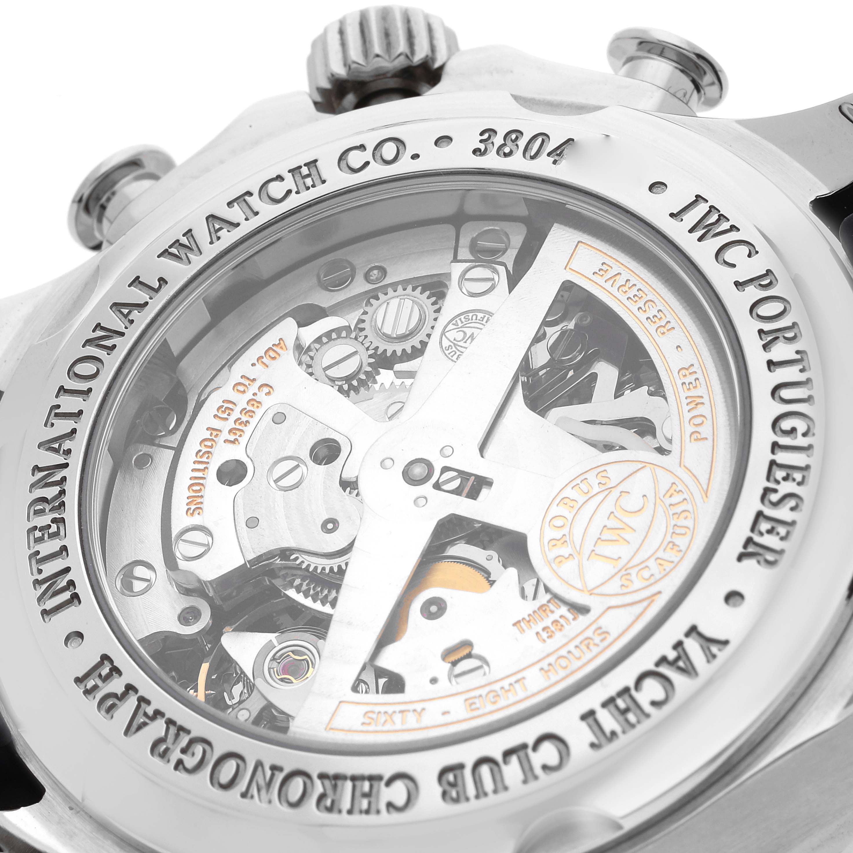 The image shows the back of an IWC Portuguese IW390210 Men's Stainless Steel Black Dial watch, highlighting the movement and engraved details.
