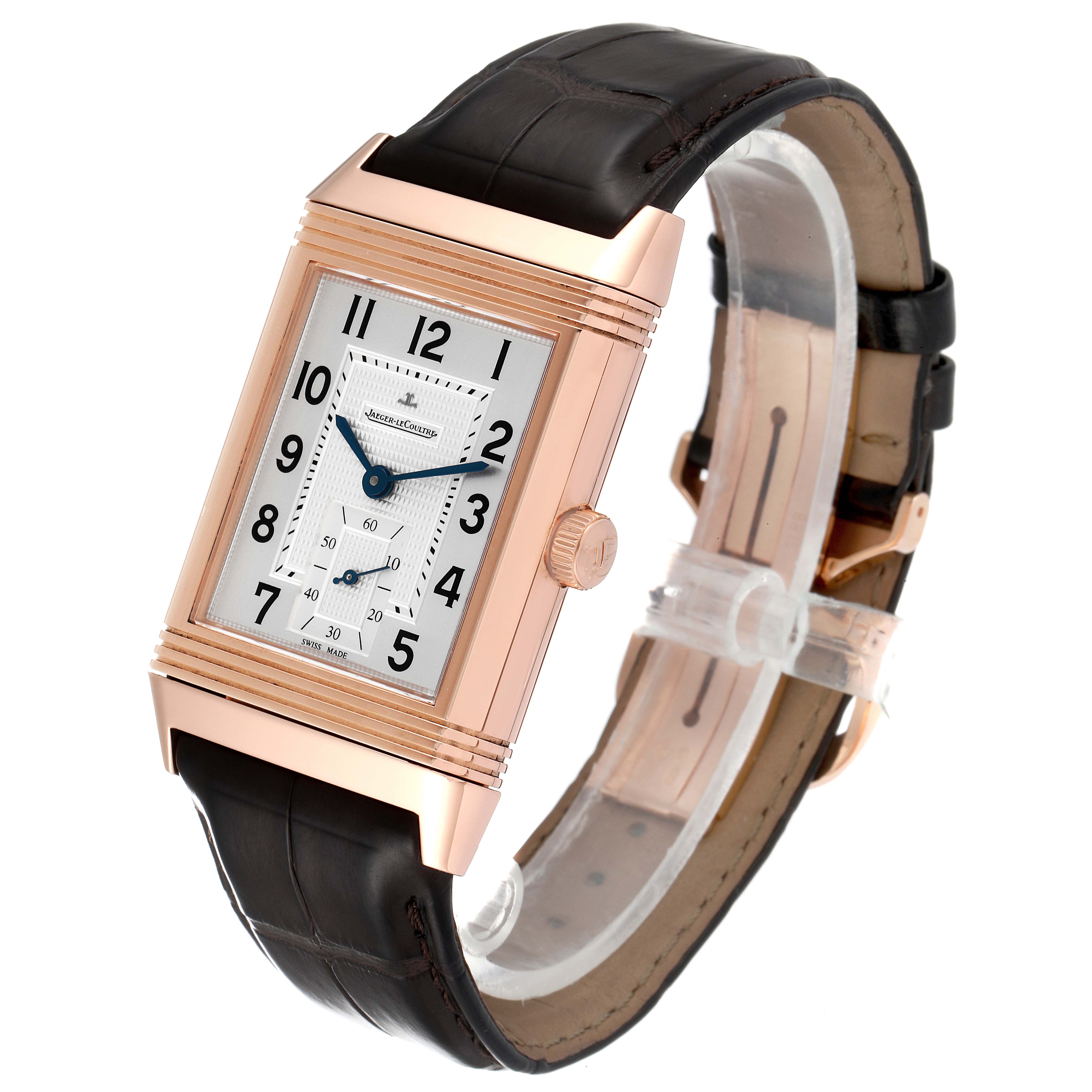 The Jaeger LeCoultre Reverso Q3732420 Men
s Rose Gold Silver Dial Q3732420 Men
s Rose Gold Silver Dial watch is shown at a slight angle revealing its rectangular face and black leather strap.