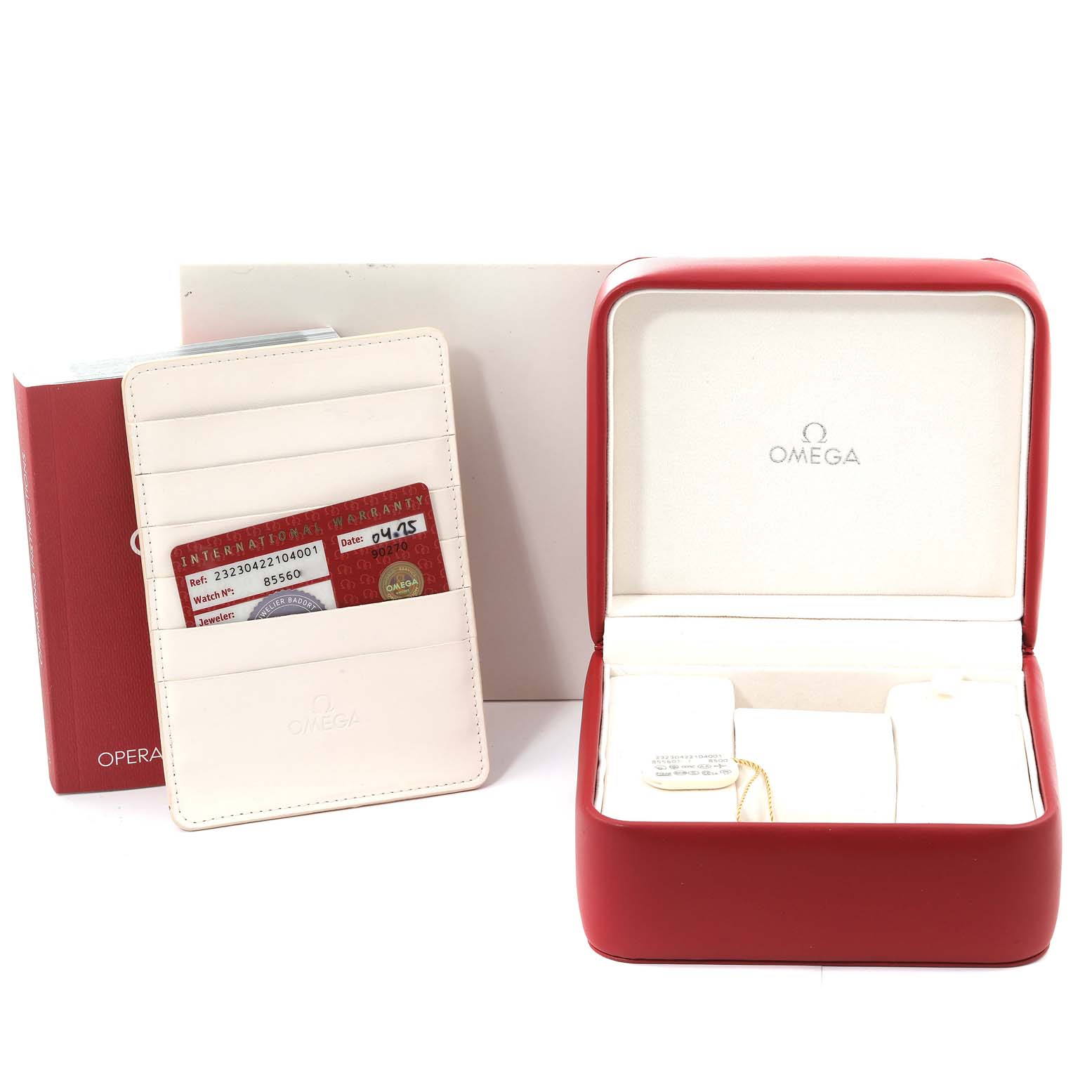The image shows the accessories for an Omega Planet Ocean 232.30.42.21.04.001 Men
s Stainless Steel White Dial 232.30.42.21.04.001 Men
s Stainless Steel White Dial watch, including a red watch box, warranty card, and manual.