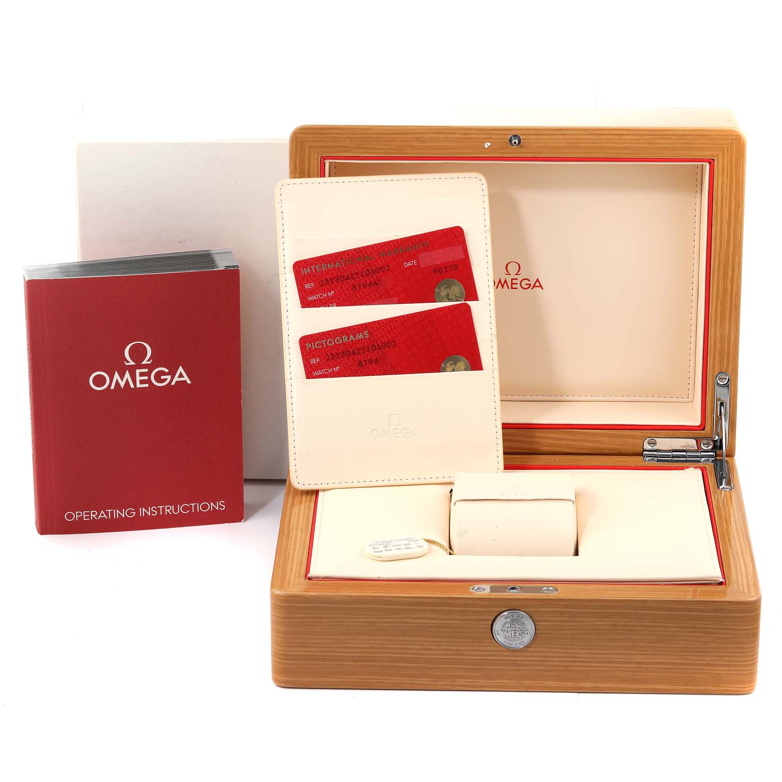 A frontal view of the Omega Planet Ocean 232.30.42.21.01.002 Men
s Stainless Steel Black Dial 232.30.42.21.01.002 Men
s Stainless Steel Black Dial model watch box, showing the case, instructions, and warranty cards.