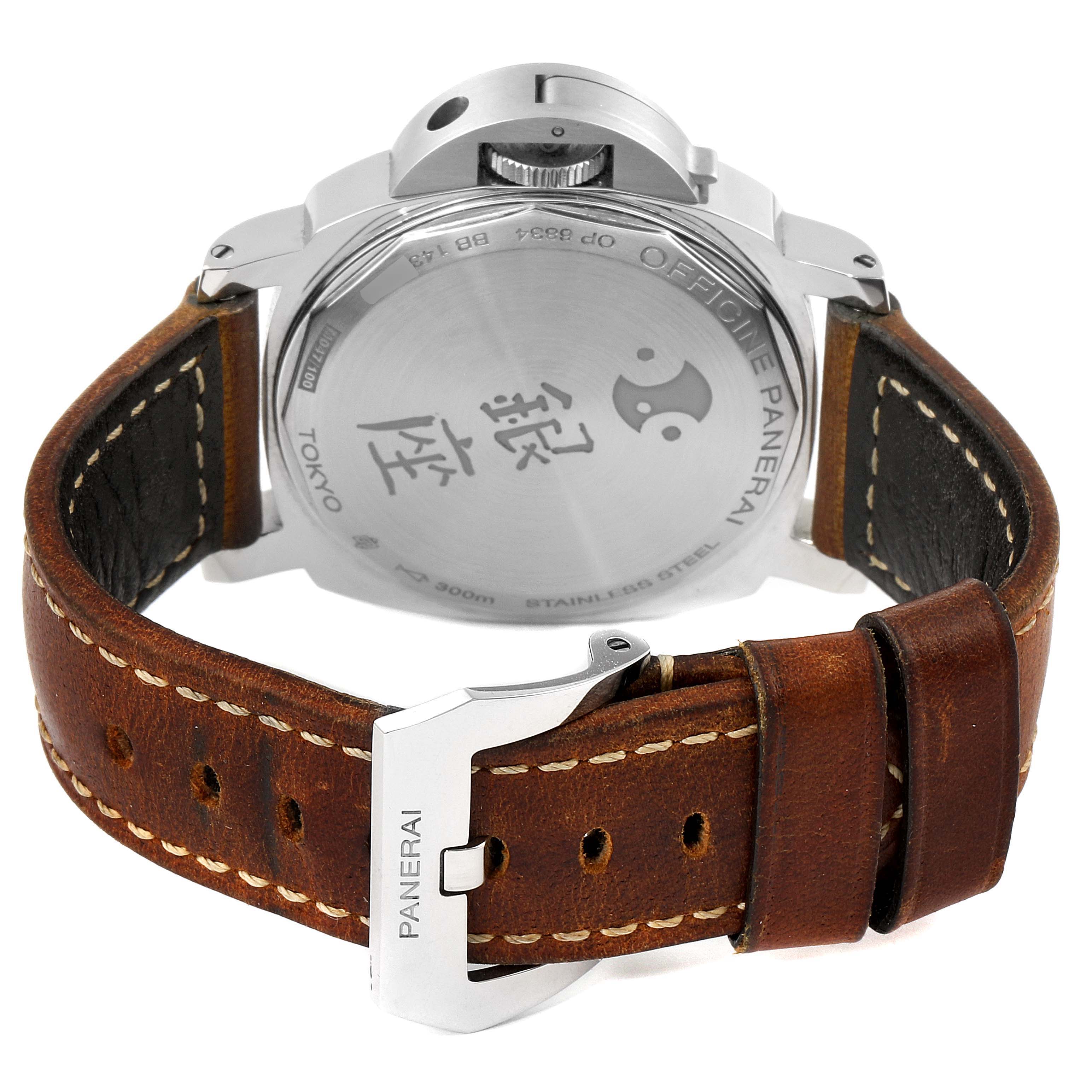 The image shows the back view of a Panerai Luminor PAM00415 Men
s Stainless Steel Black Dial PAM00415 Men
s Stainless Steel Black Dial watch with a brown leather strap and engraved stainless steel case back.