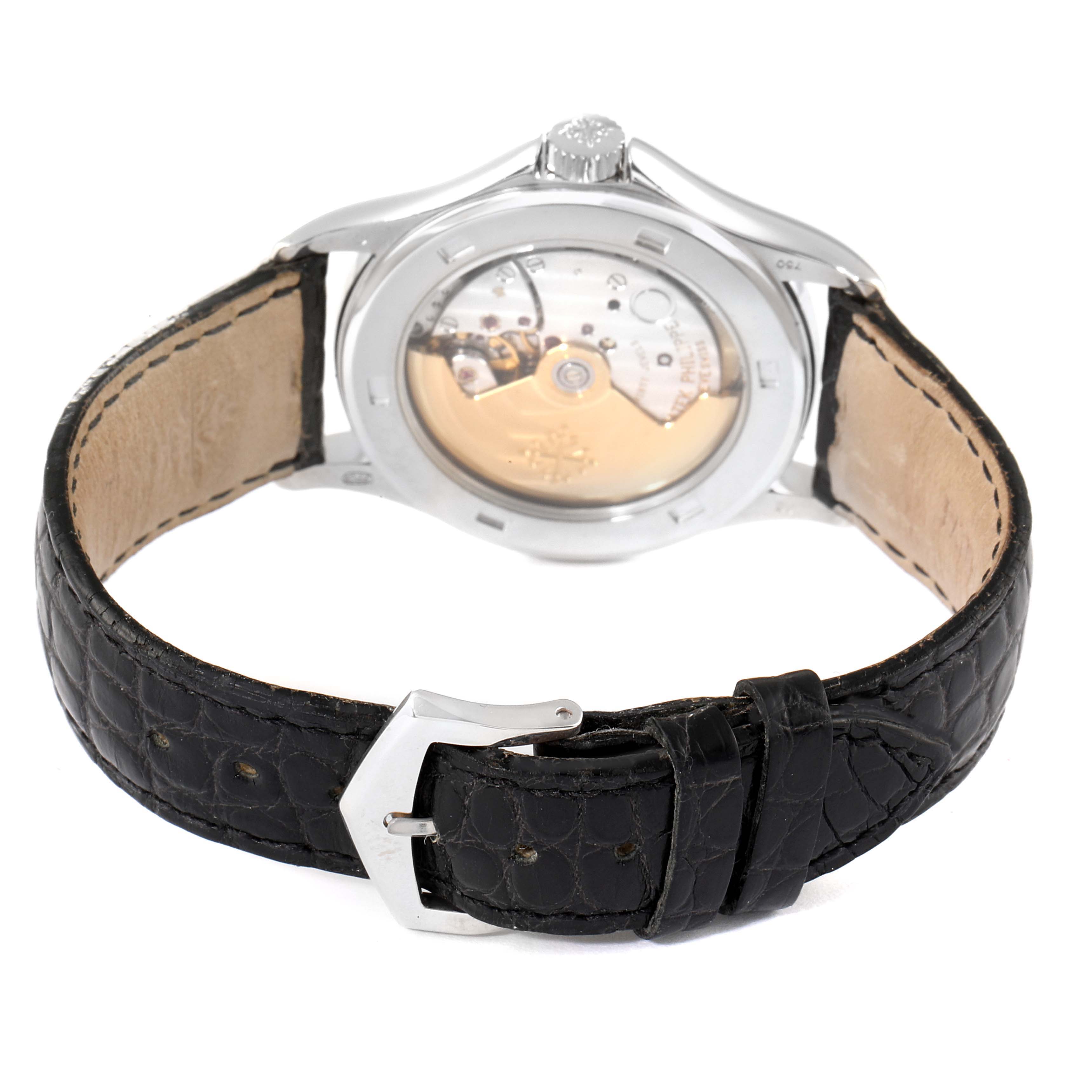 The image shows the back view of the Patek Philippe Calatrava 5107G Men
s White Gold Silver Dial 5107G Men
s White Gold Silver Dial watch, highlighting the movement through the transparent case back and the leather strap.