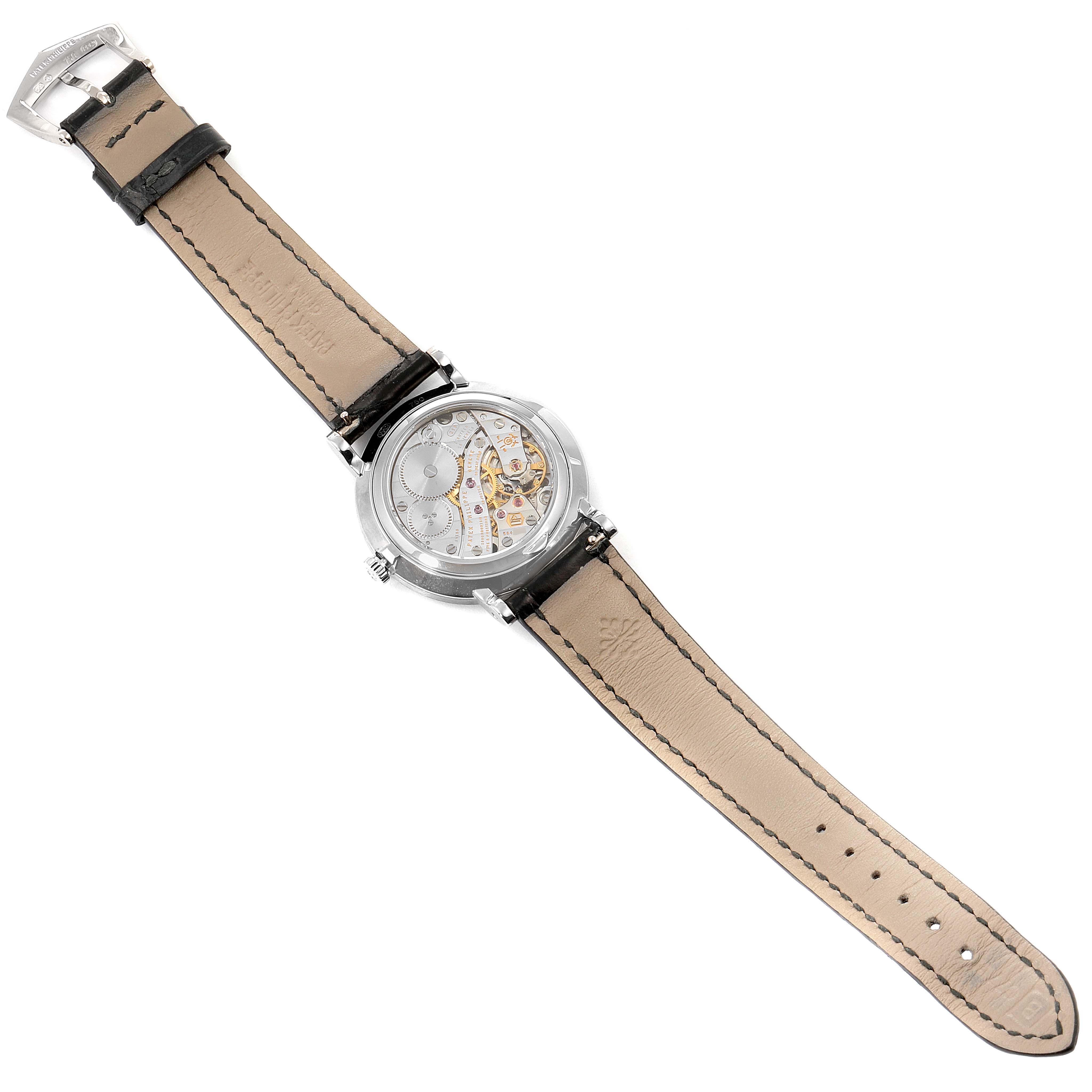 This image shows the back of a Patek Philippe Calatrava 7119G Women's White Gold White Dial 7119G Women's White Gold White Dial watch, highlighting the movement and leather strap.