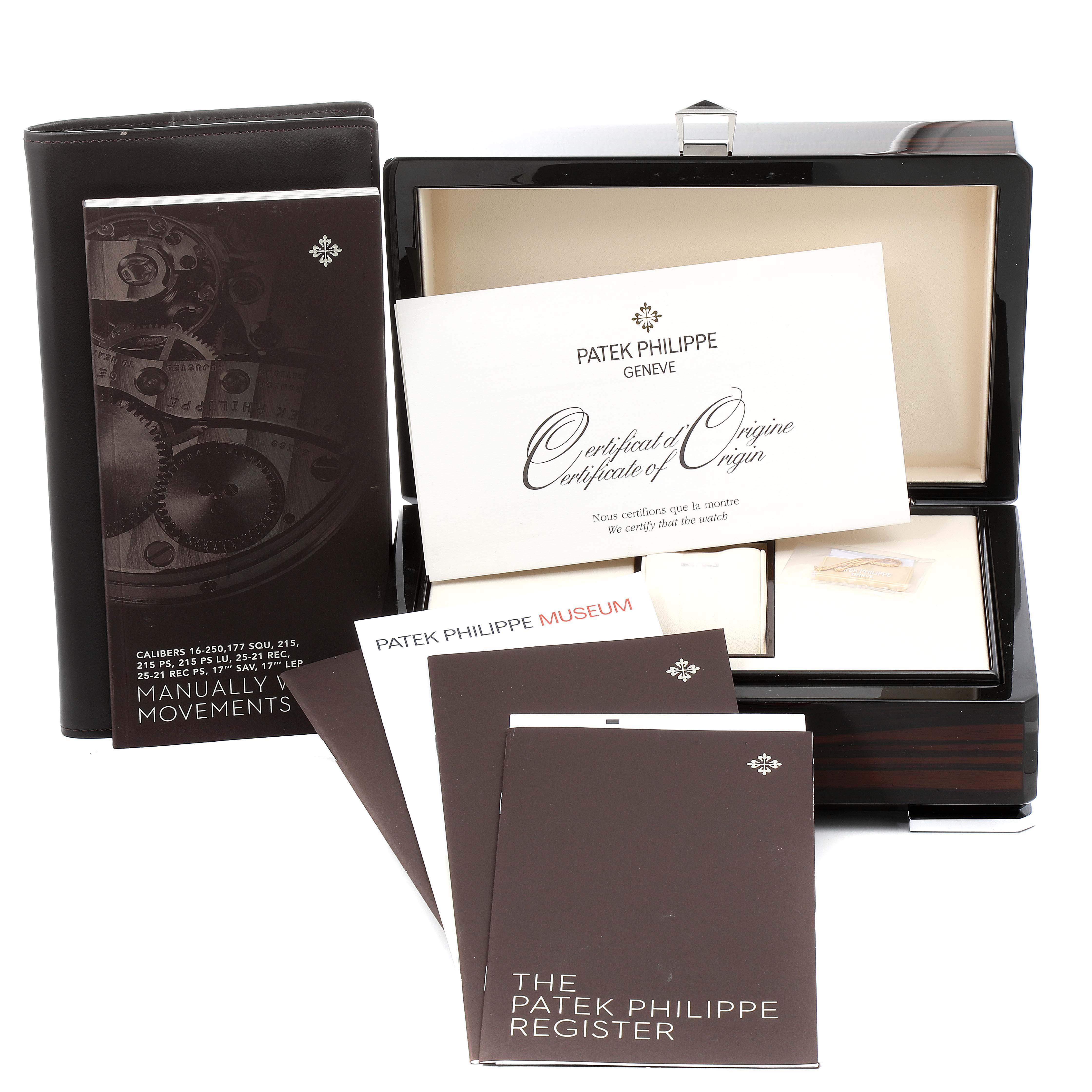 The image shows the Patek Philippe Calatrava 7119G Women's White Gold White Dial 7119G Women's White Gold White Dial model’s packaging, including a wooden box, manuals, and a certificate of origin.