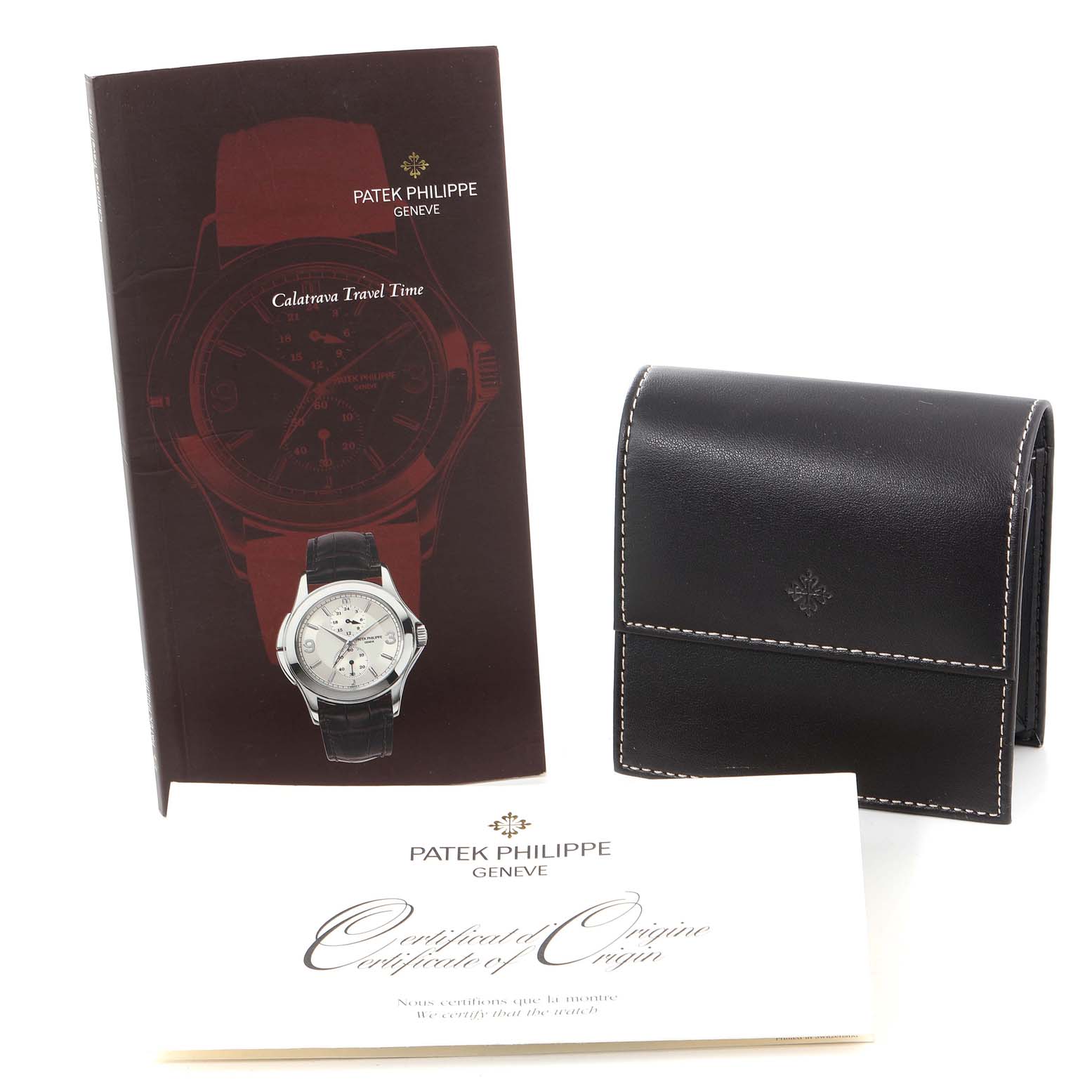 The image shows a Patek Philippe Calatrava 5134J Men
s Yellow Gold White Dial 5134J Men
s Yellow Gold White Dial model watch with accessories including a booklet, a carrying case, and a certificate.