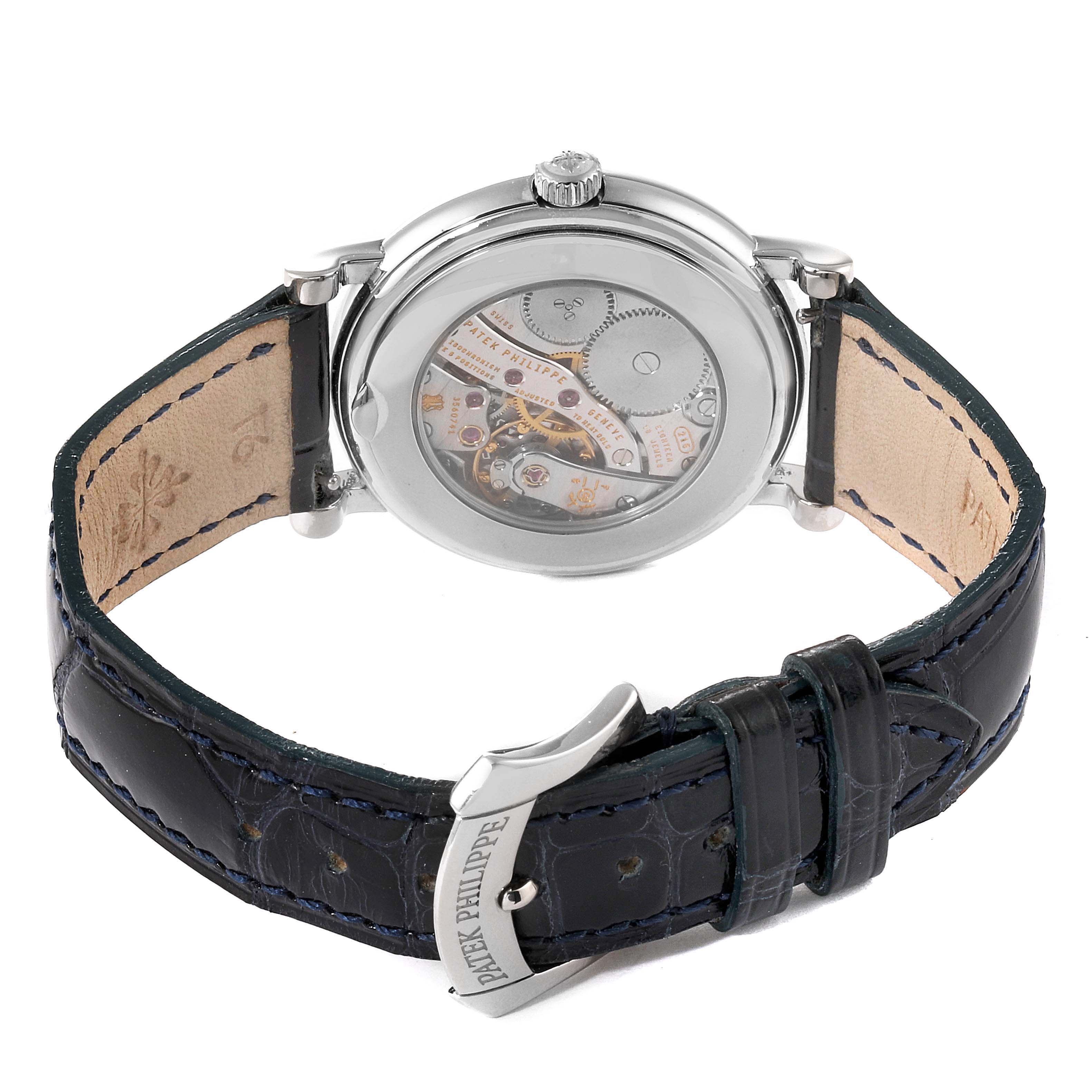 This is a rear view of the Patek Philippe Calatrava 4959G Women's White Gold Mother of Pearl Dial 4959G Women's White Gold Mother of Pearl Dial watch showing the movement through the transparent case back and leather strap.