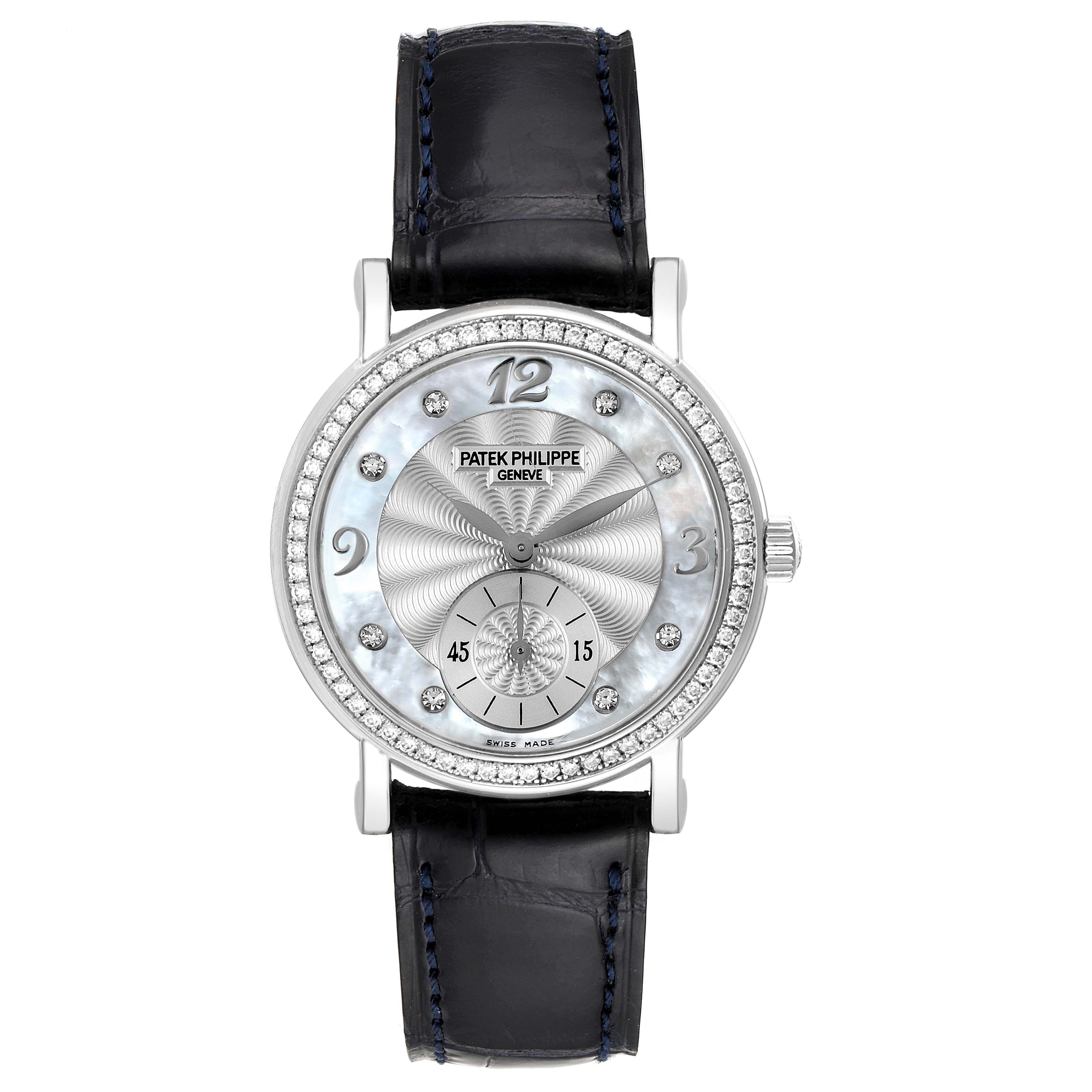 The image shows a front view of a Patek Philippe Calatrava 4959G Women's White Gold Mother of Pearl Dial 4959G Women's White Gold Mother of Pearl Dial watch with a black leather strap and a diamond-studded bezel.