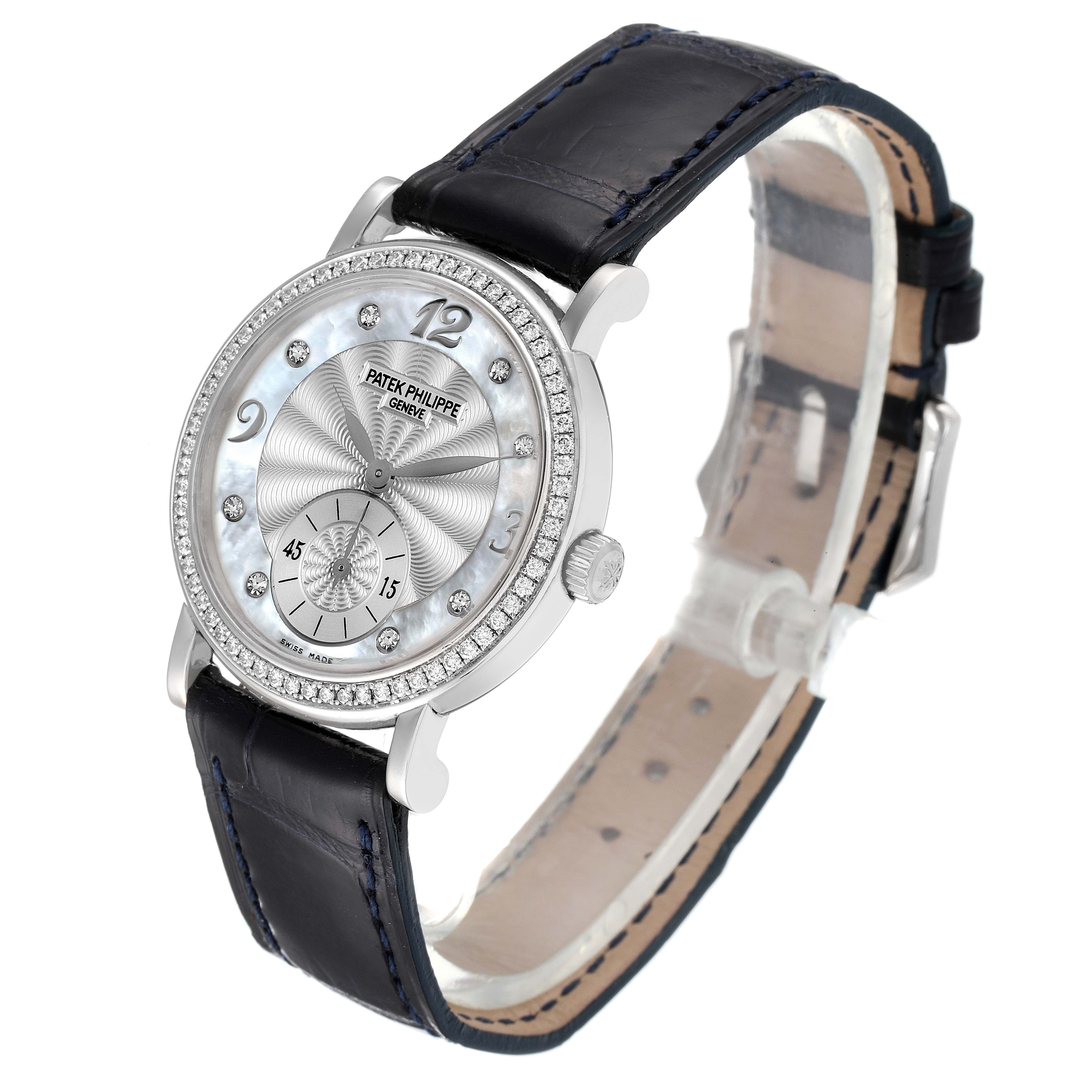 The Patek Philippe Calatrava 4959G Women's White Gold Mother of Pearl Dial 4959G Women's White Gold Mother of Pearl Dial watch is shown at an angle displaying the dial, bezel, crown, and leather strap.