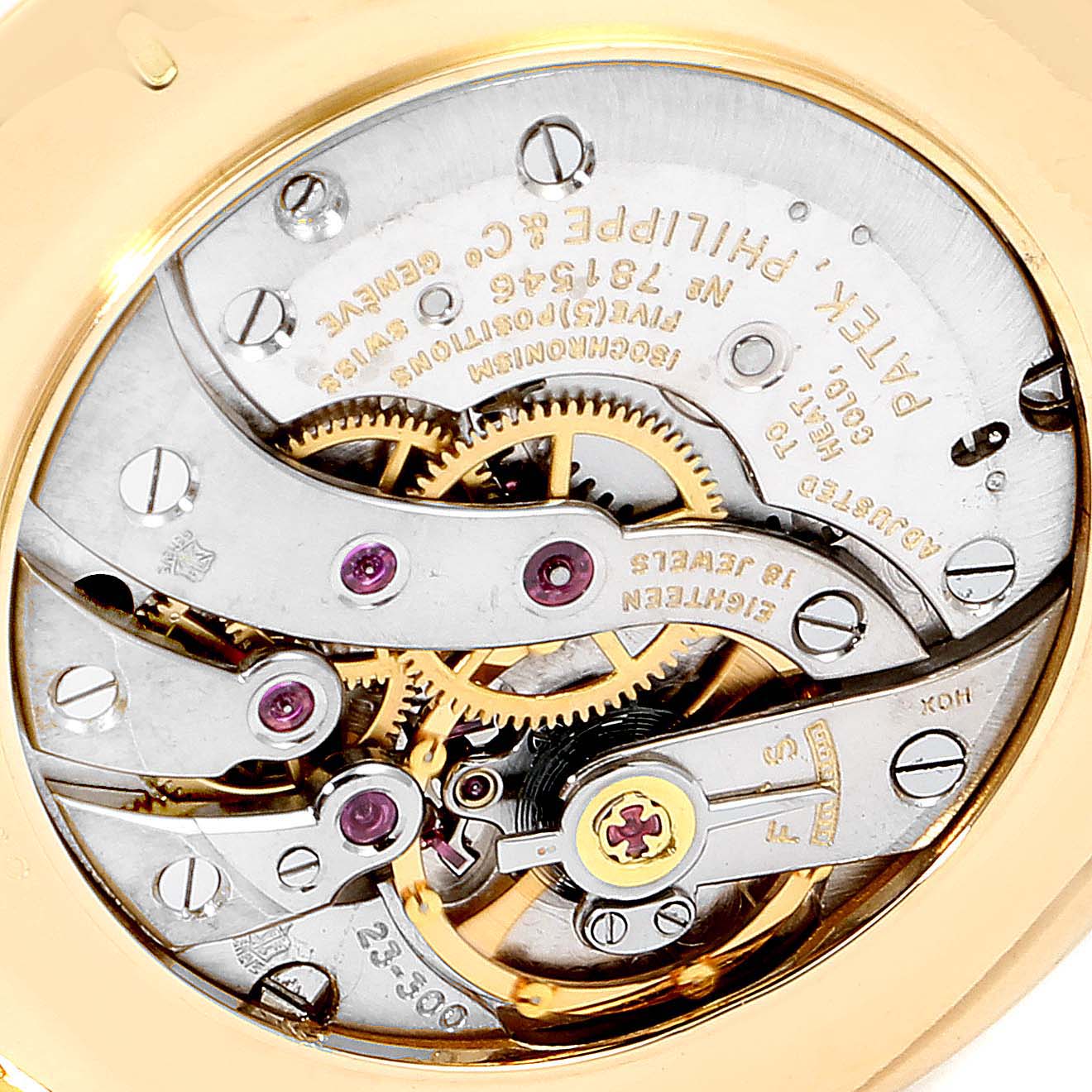 The image shows a close-up view of the movement and inner workings of a vintage Patek Philippe watch.