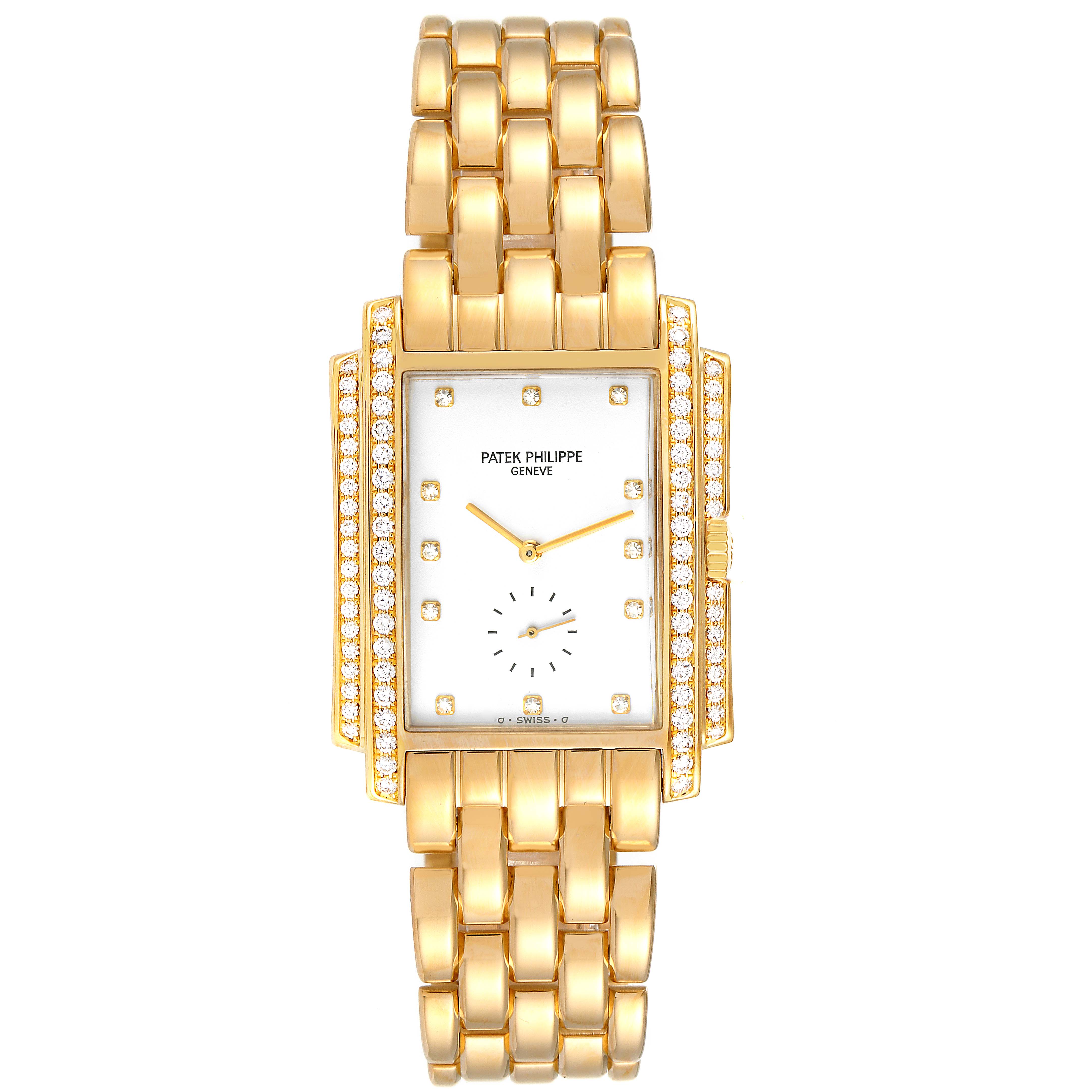 The Patek Philippe Gondolo 5025J Men
s Yellow Gold White Dial 5025J Men
s Yellow Gold White Dial watch is shown from a front angle, displaying its gold band, diamond-studded rectangular case, and dial.