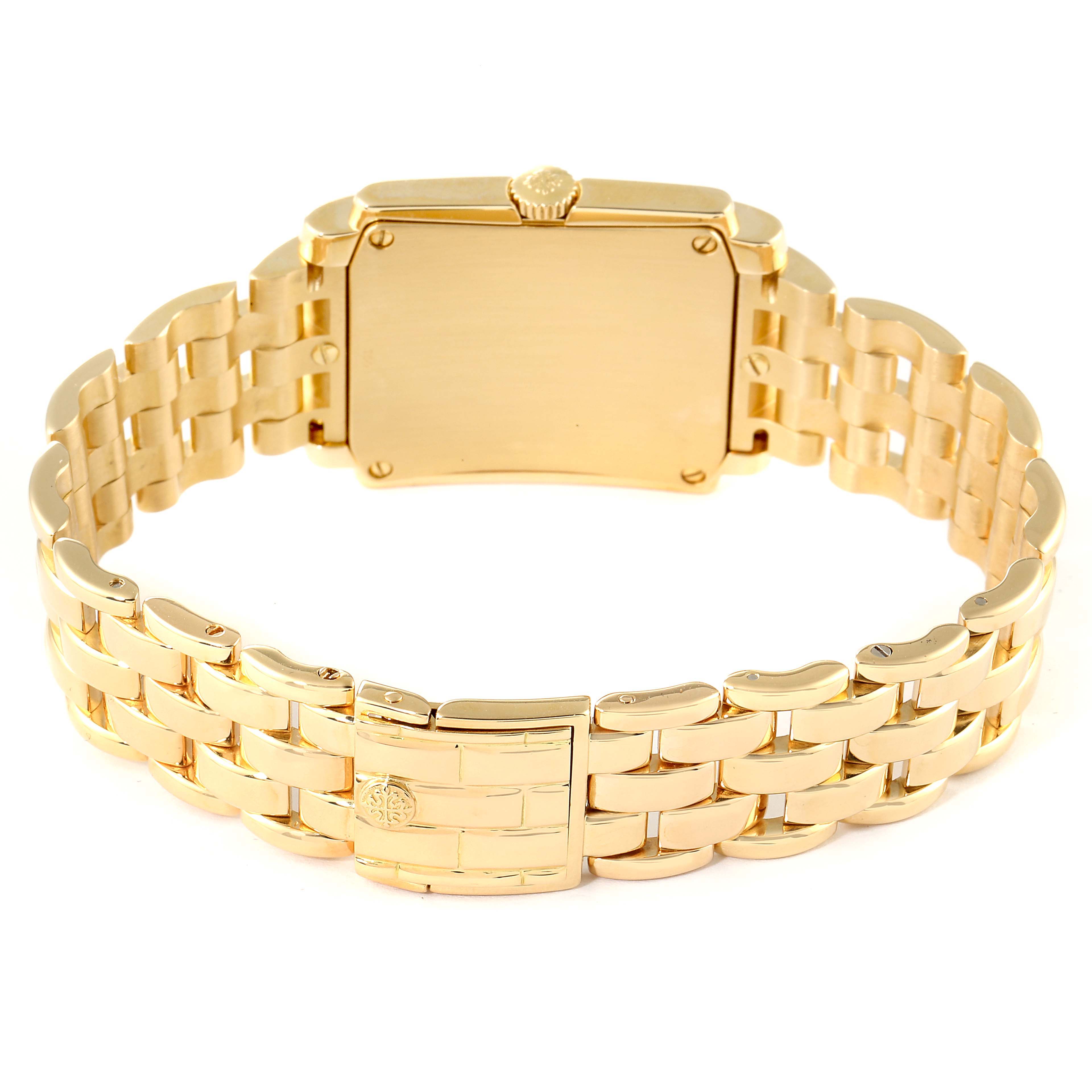 The image shows the back view of a Patek Philippe Gondolo 5025J Men
s Yellow Gold White Dial 5025J Men
s Yellow Gold White Dial watch and its gold bracelet.