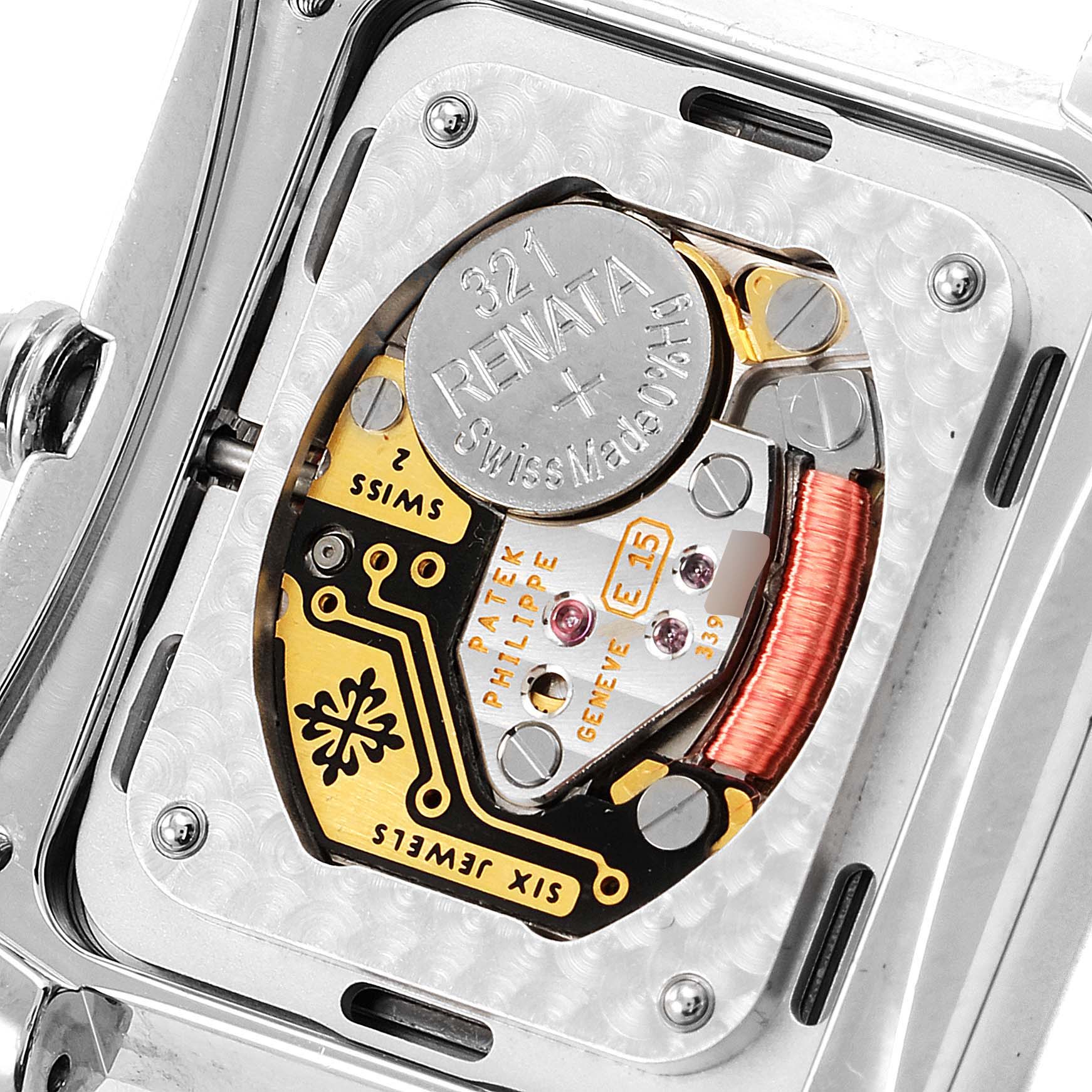 This close-up image shows the intricate internal mechanism of the Patek Philippe Twenty-4 4910/10A-010 Women's Stainless Steel Grey Dial 4910/10A-010 Women's Stainless Steel Grey Dial model watch, including the battery and gears.