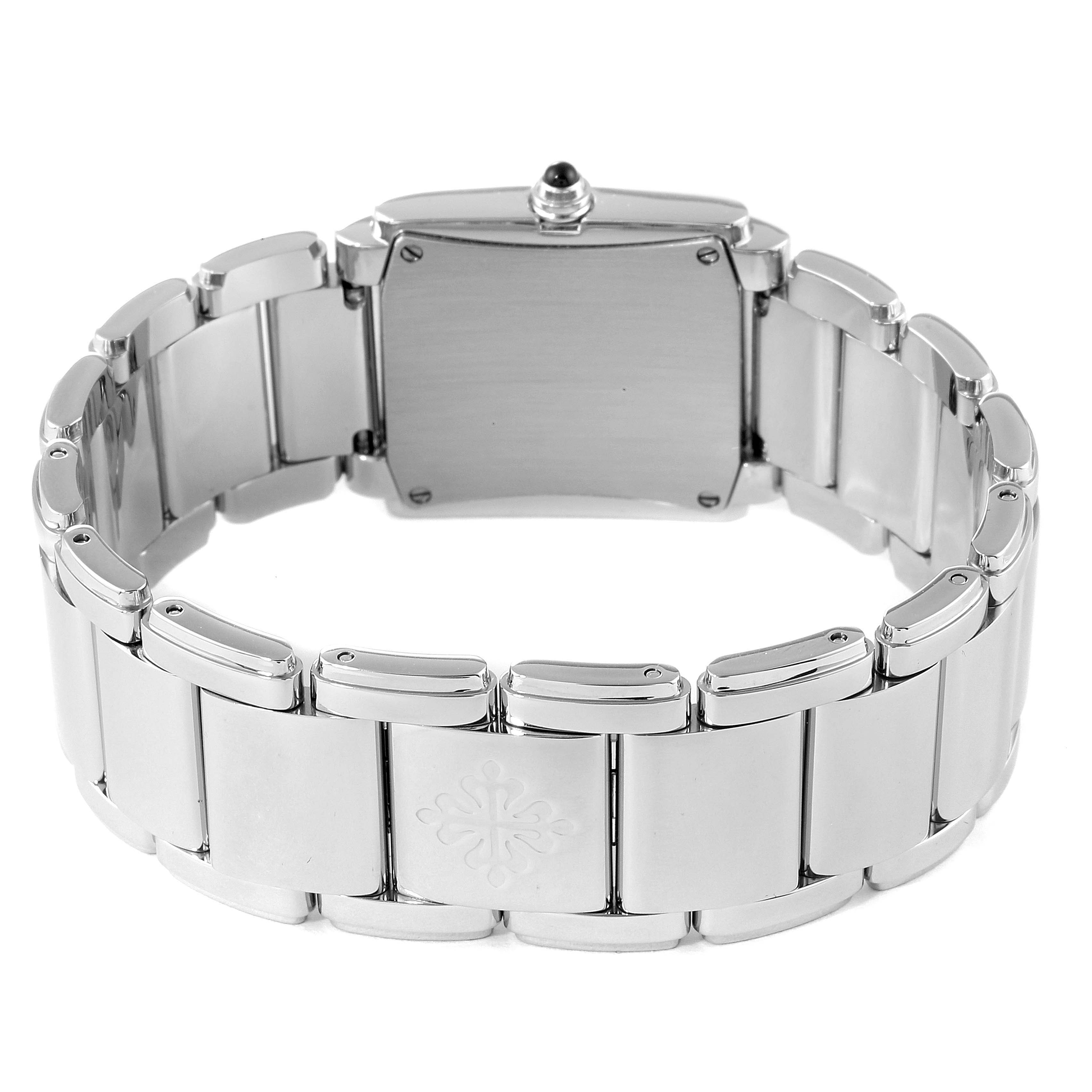 The image shows the back view of a Patek Philippe Twenty-4 4910/10A-010 Women's Stainless Steel Grey Dial 4910/10A-010 Women's Stainless Steel Grey Dial model watch, highlighting its metal bracelet and clasp.