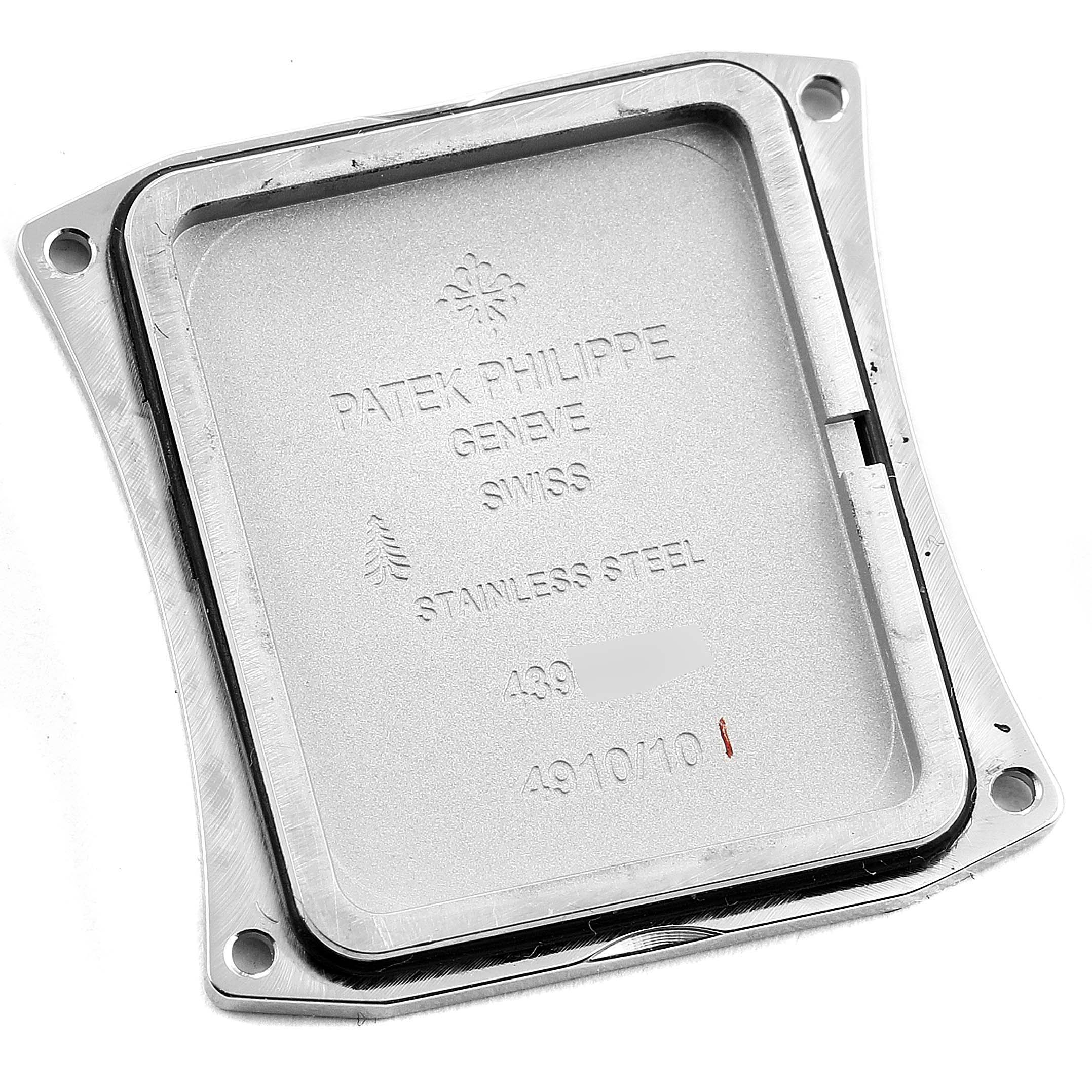 The image shows the back case of a Patek Philippe Twenty-4 4910/10A-010 Women's Stainless Steel Grey Dial 4910/10A-010 Women's Stainless Steel Grey Dial watch from a top-down angle.