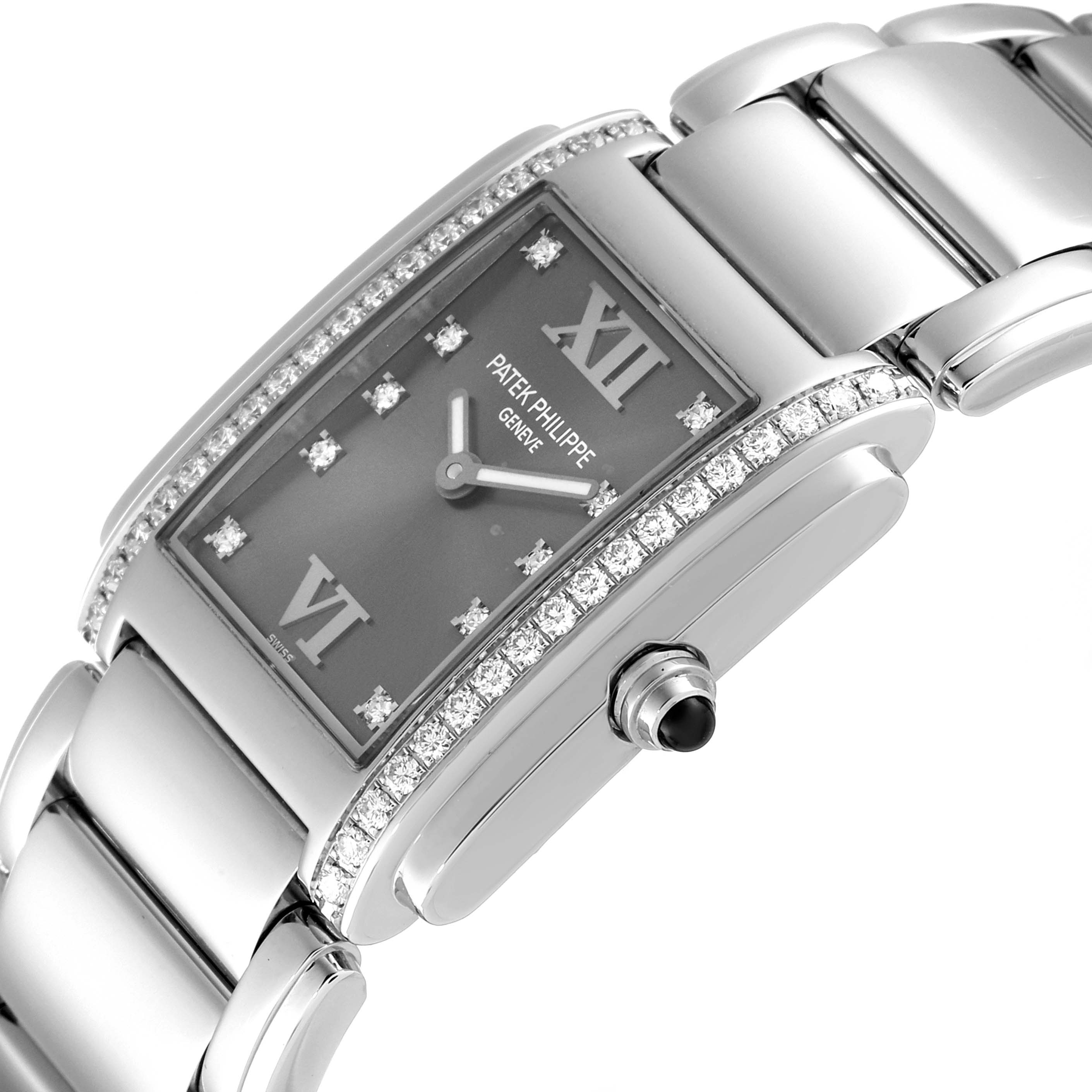 This Patek Philippe Twenty-4 4910/10A-010 Women's Stainless Steel Grey Dial 4910/10A-010 Women's Stainless Steel Grey Dial watch is shown from an angled side close-up, highlighting its dial, bezel, and bracelet.