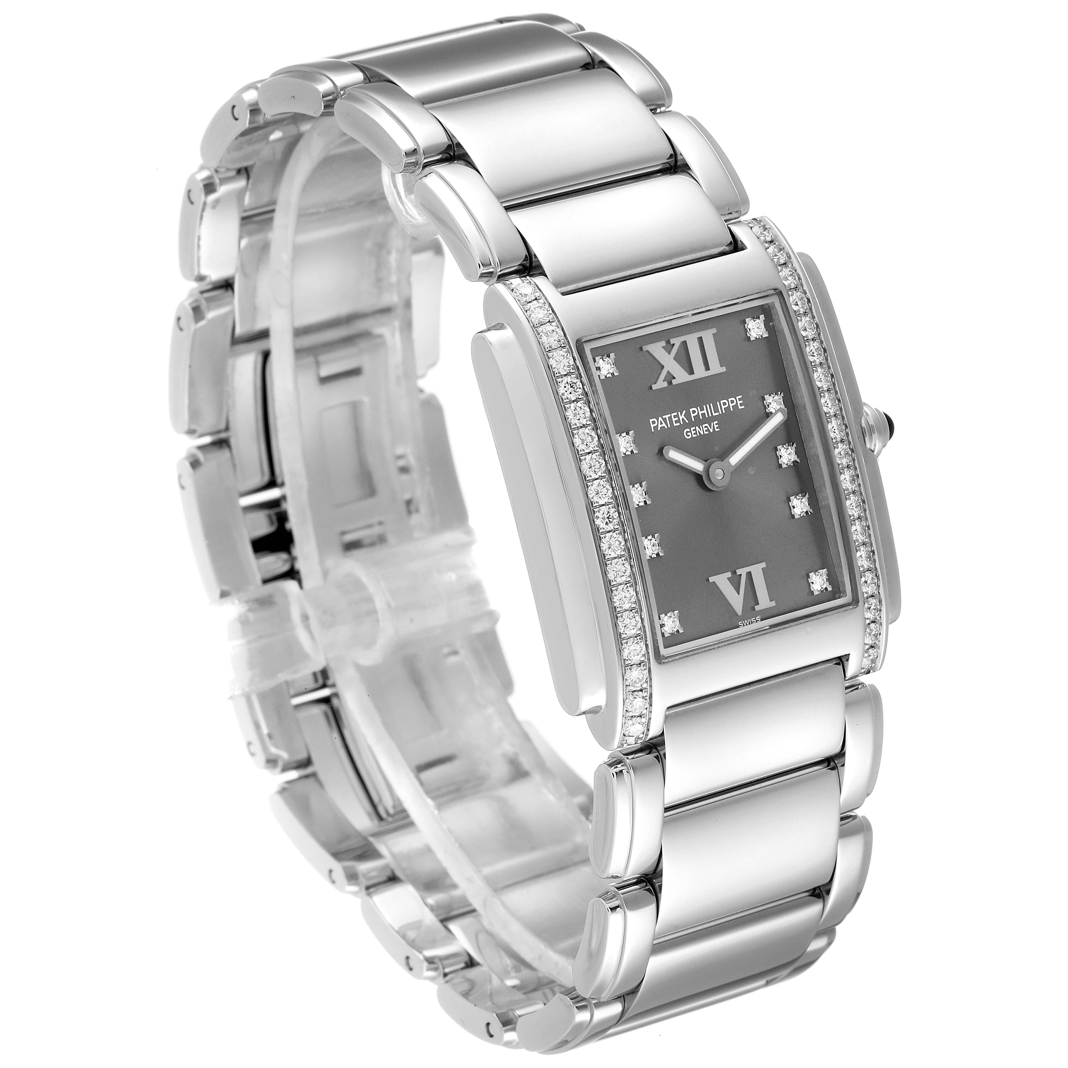 The image shows a Patek Philippe Twenty-4 4910/10A-010 Women's Stainless Steel Grey Dial 4910/10A-010 Women's Stainless Steel Grey Dial watch at an angled view, highlighting its rectangular face, bracelet, and diamond accents.