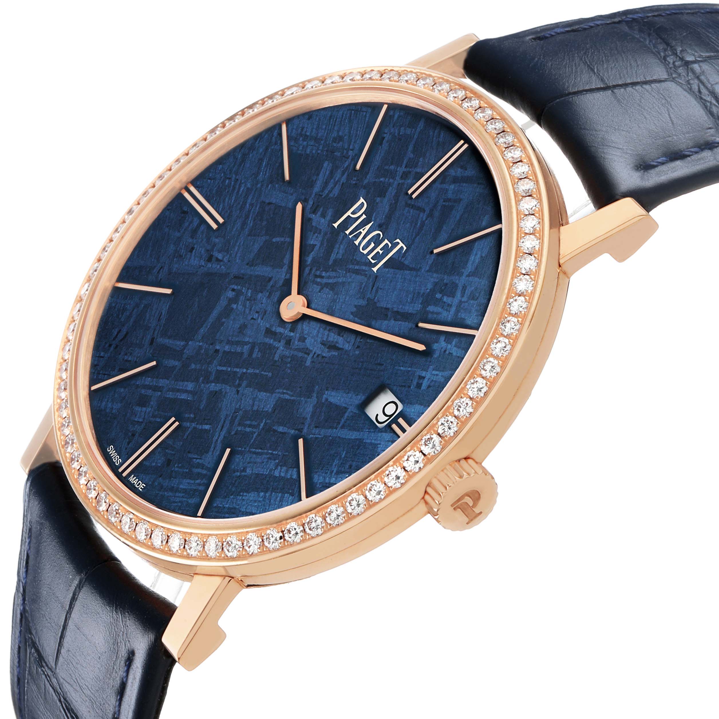 The Piaget G0A44052 Men's Rose Gold Blue Dial Altiplano model GOA44052 is shown at a slight angle, highlighting the rose gold case, diamond bezel, blue textured dial, and black strap.