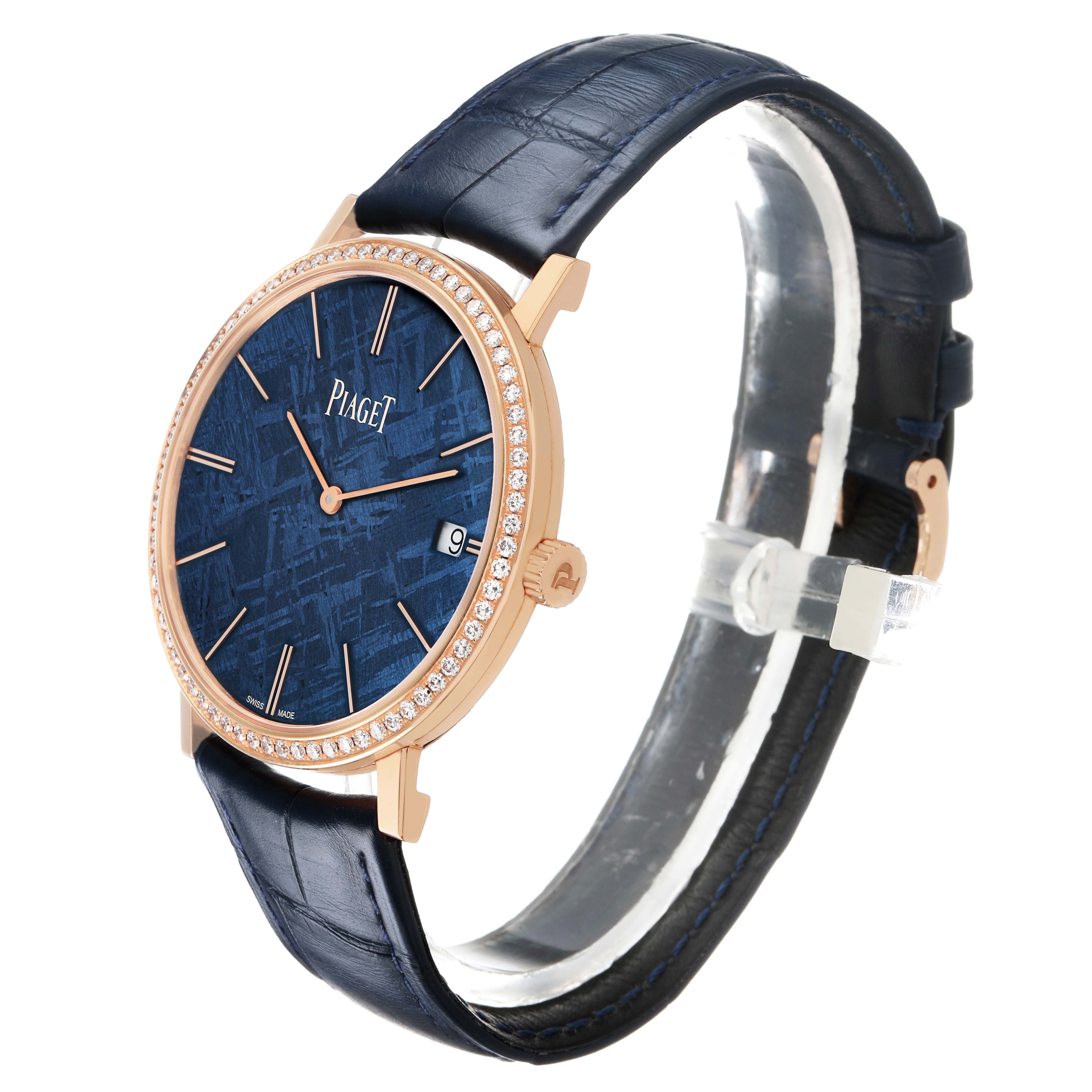 The Piaget G0A44052 Men's Rose Gold Blue Dial Altiplano GOA44052 watch is shown at a side angle, highlighting its rose gold case, diamond bezel, blue meteorite dial, and leather strap.