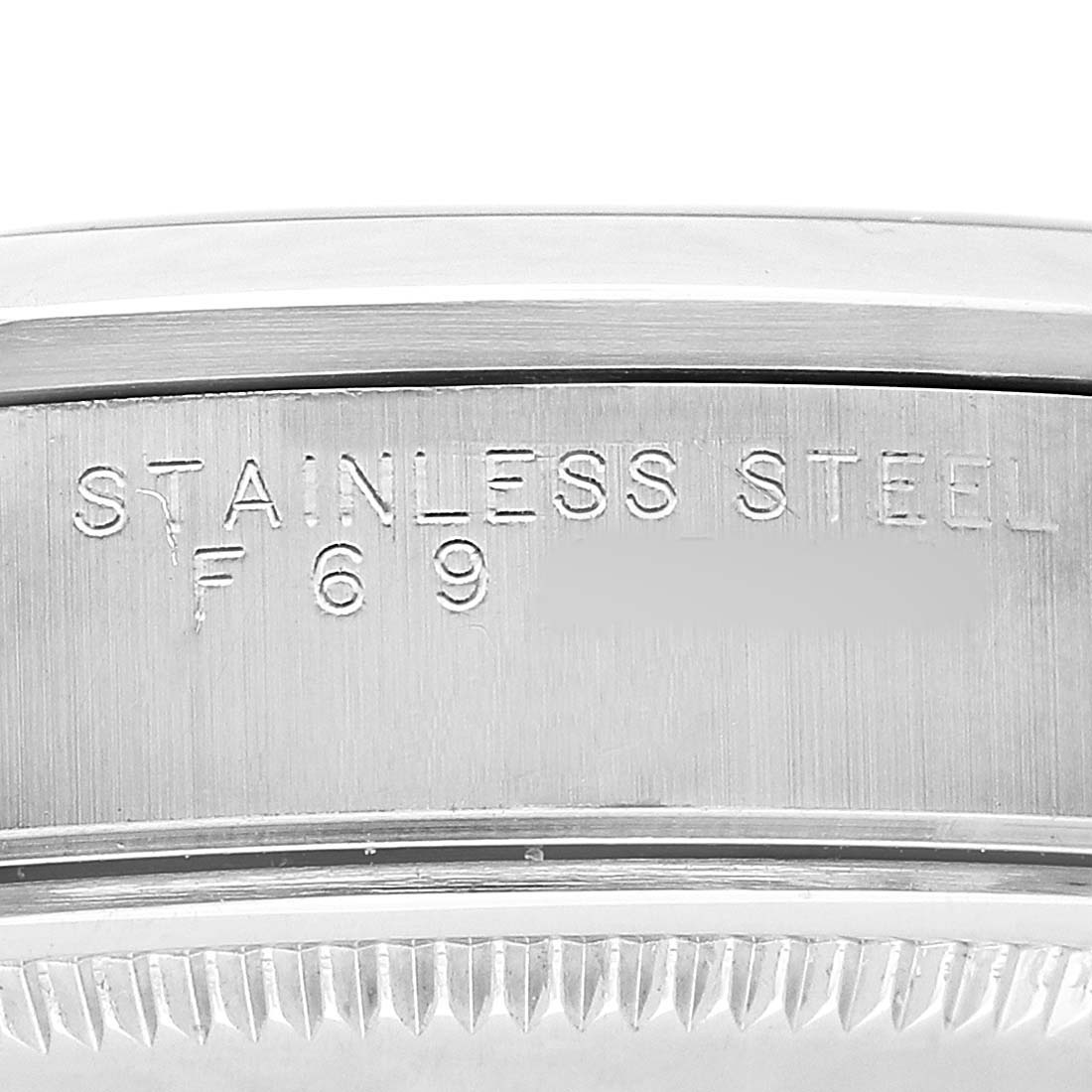 The image shows the side of a Rolex Air-King 14000 Men's Stainless Steel Black Dial watch, highlighting the "STAINLESS STEEL" engraving on the case.
