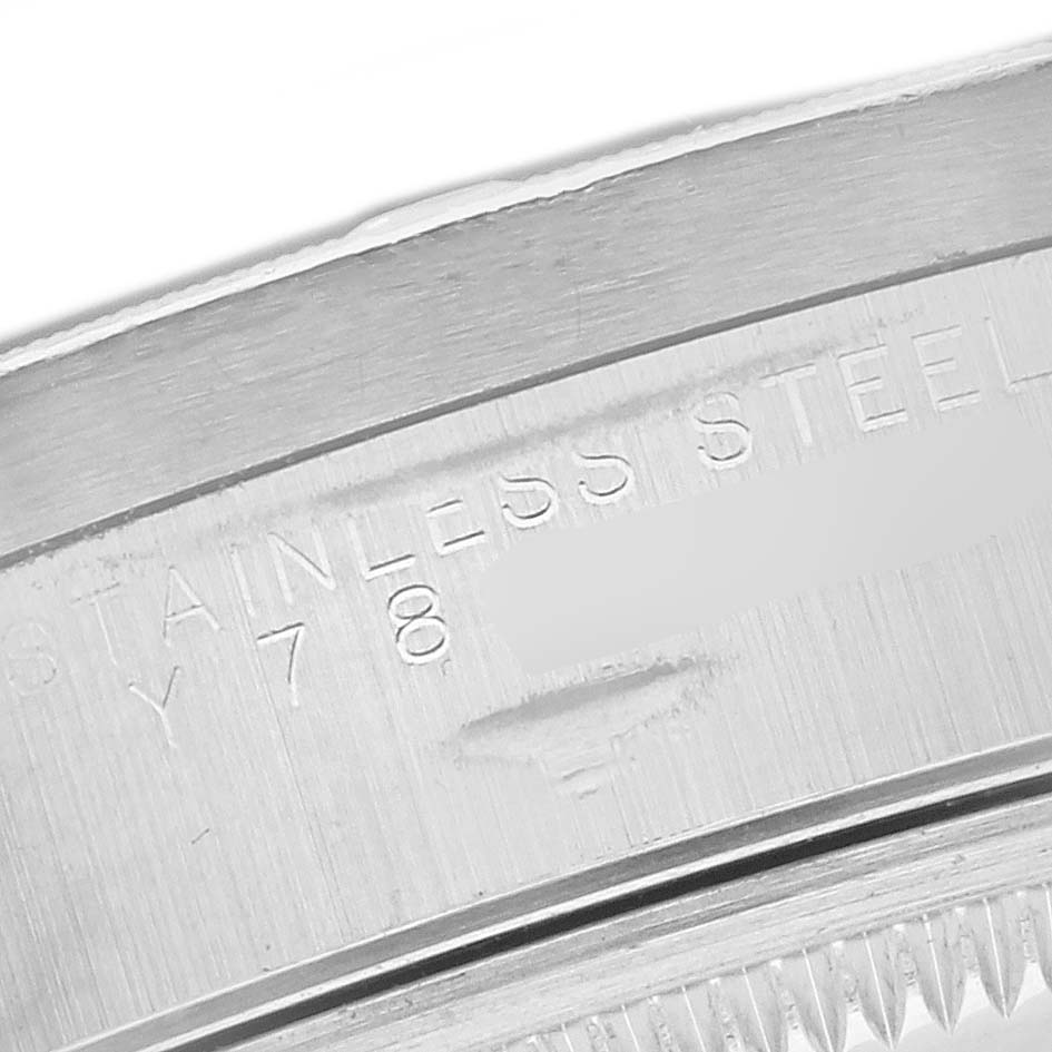 The image shows a close-up of the stainless steel casing of a Rolex Air-King 14010M Men's Stainless Steel Black Dial 14010M Men's Stainless Steel Black Dial watch, highlighting engraved details.