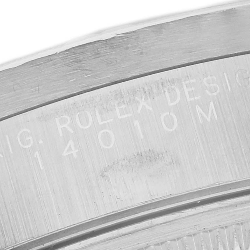 The image shows the engraved inner bezel of a Rolex Air-King 14010M Men's Stainless Steel Black Dial 14010M Men's Stainless Steel Black Dial watch at a close-up angle.